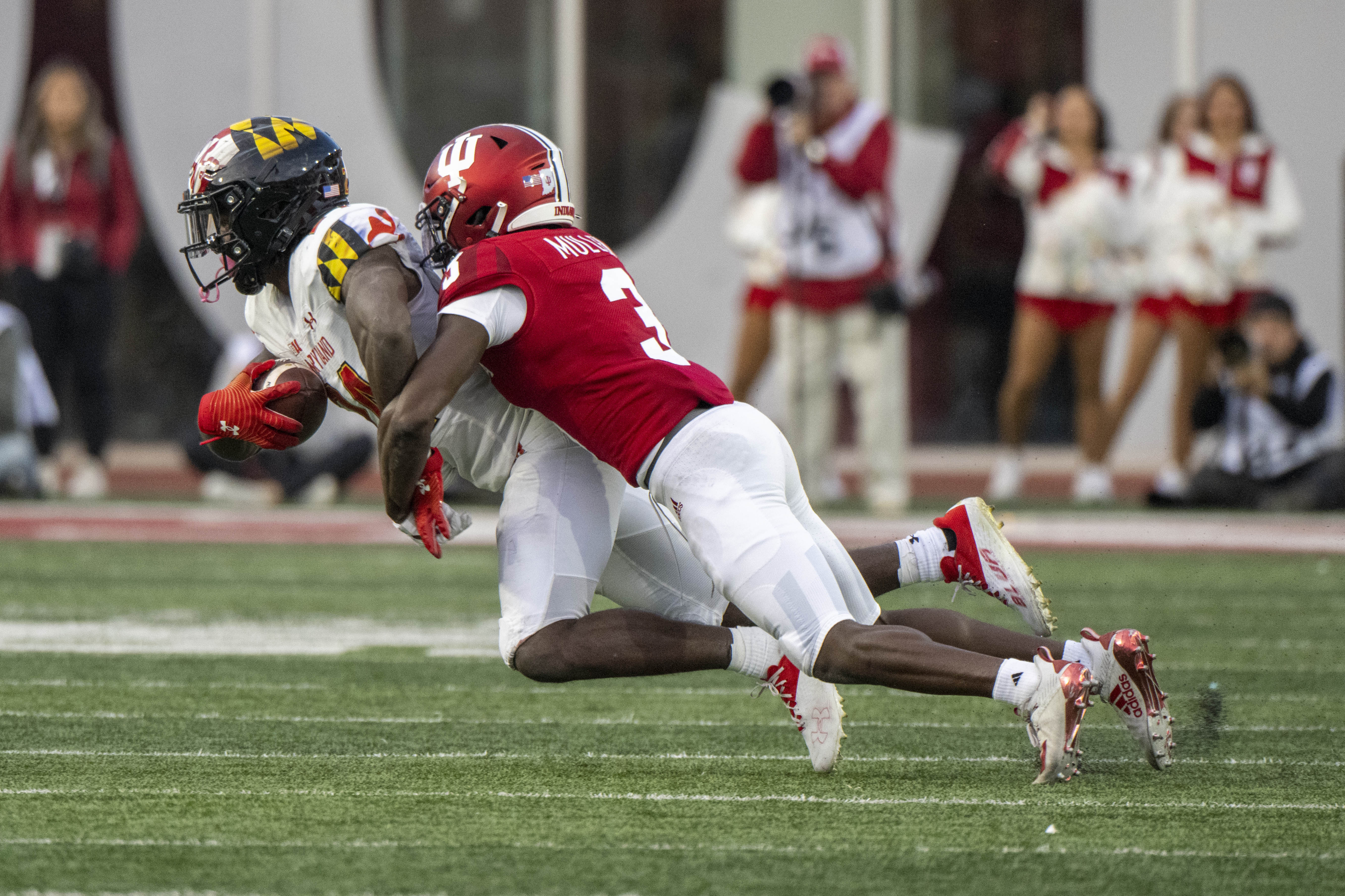 Maryland Terrapins running back Roman Hemby (24) is tackled by Indiana Hoosiers defensive back Tiawan Mullen (3) during the second half at Memorial Stadium.