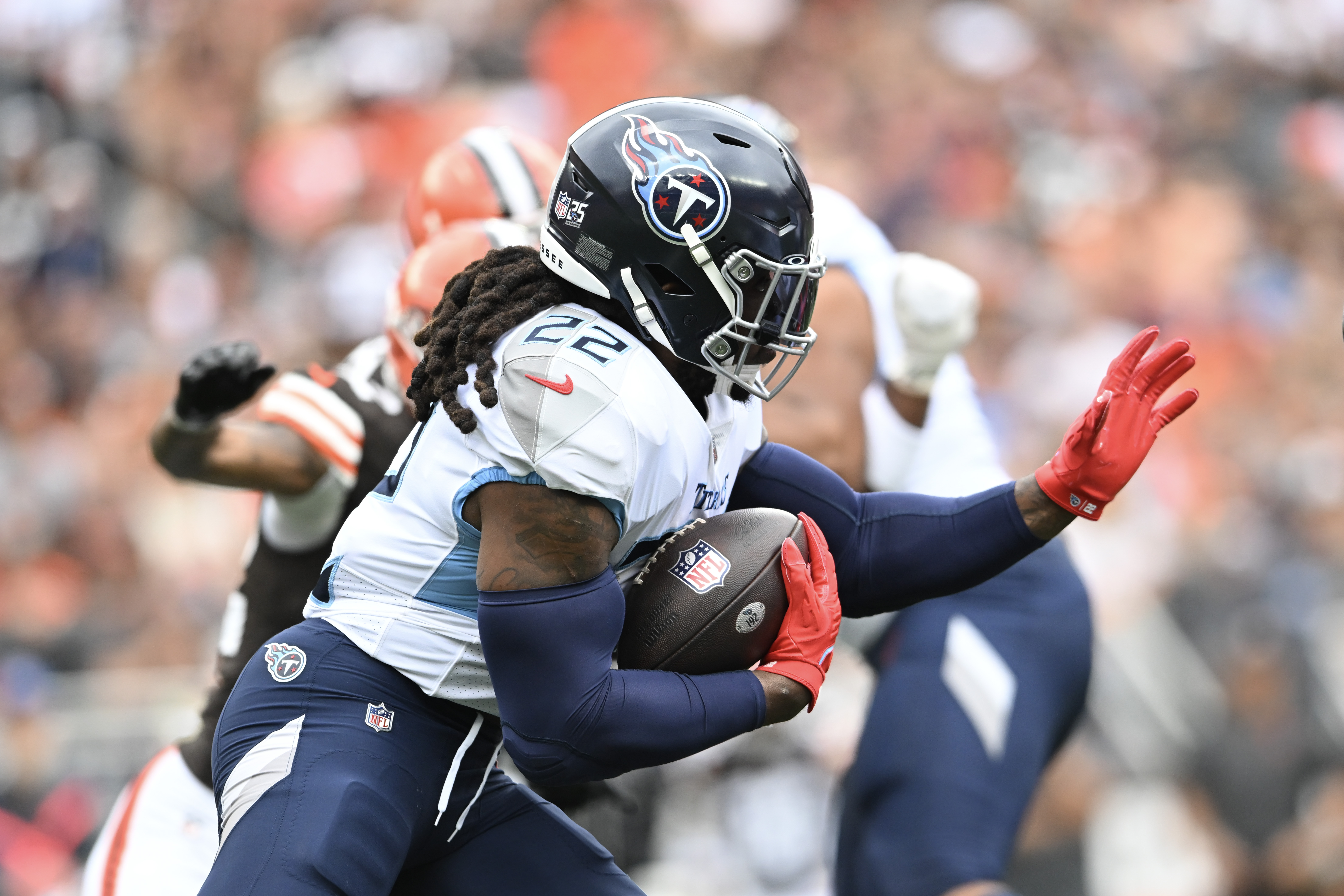 Derrick Henry #22 of the Tennessee Titans runs the ball during the first half in the game against the Cleveland Brown at Cleveland Browns Stadium on September 24, 2023 in Cleveland, Ohio.