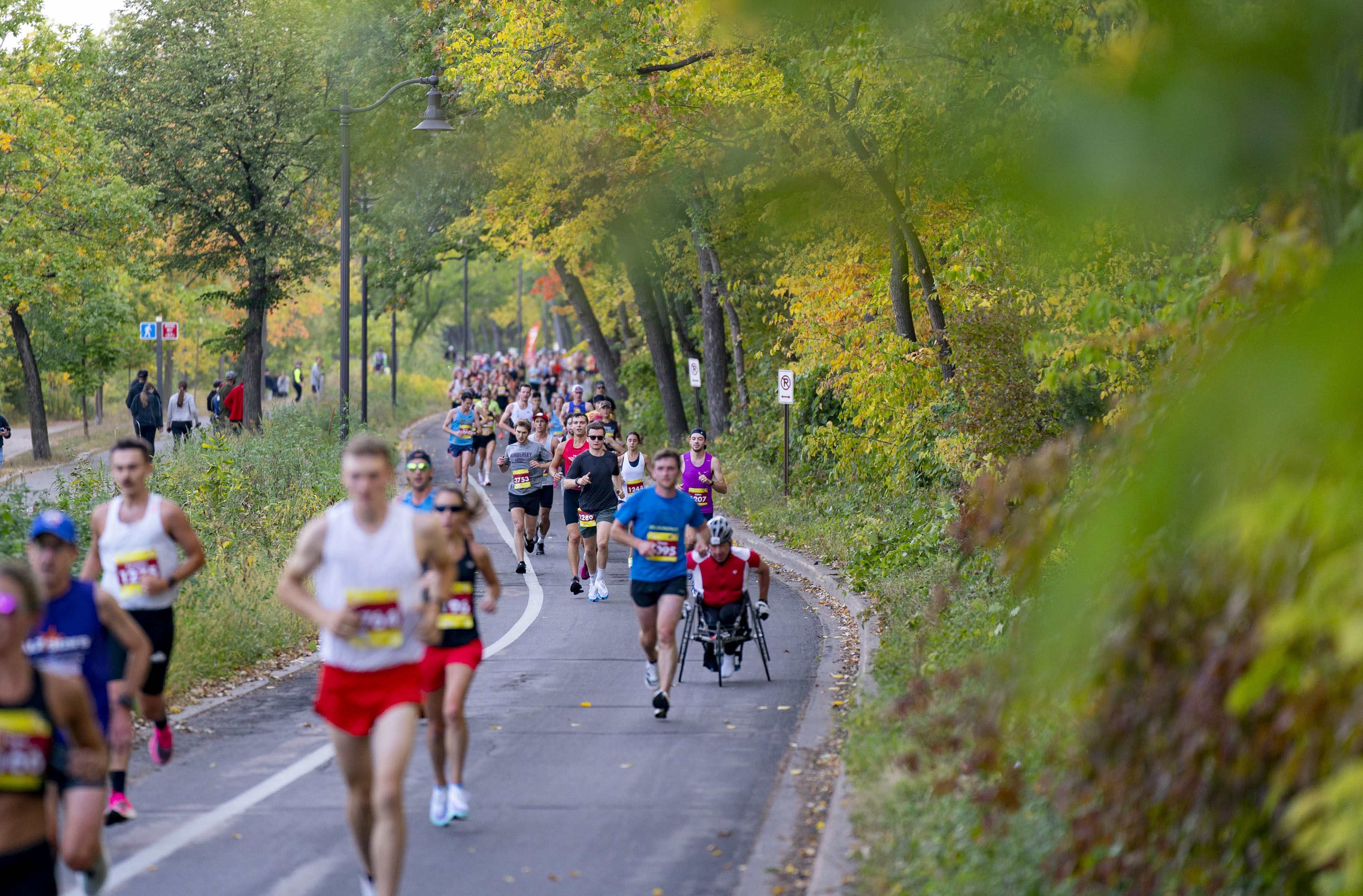 Runners make their way past Lake Harriet during the Twin Cities Marathon Sunday, Oct. 2, 2022 in Minneapolis, Minn.