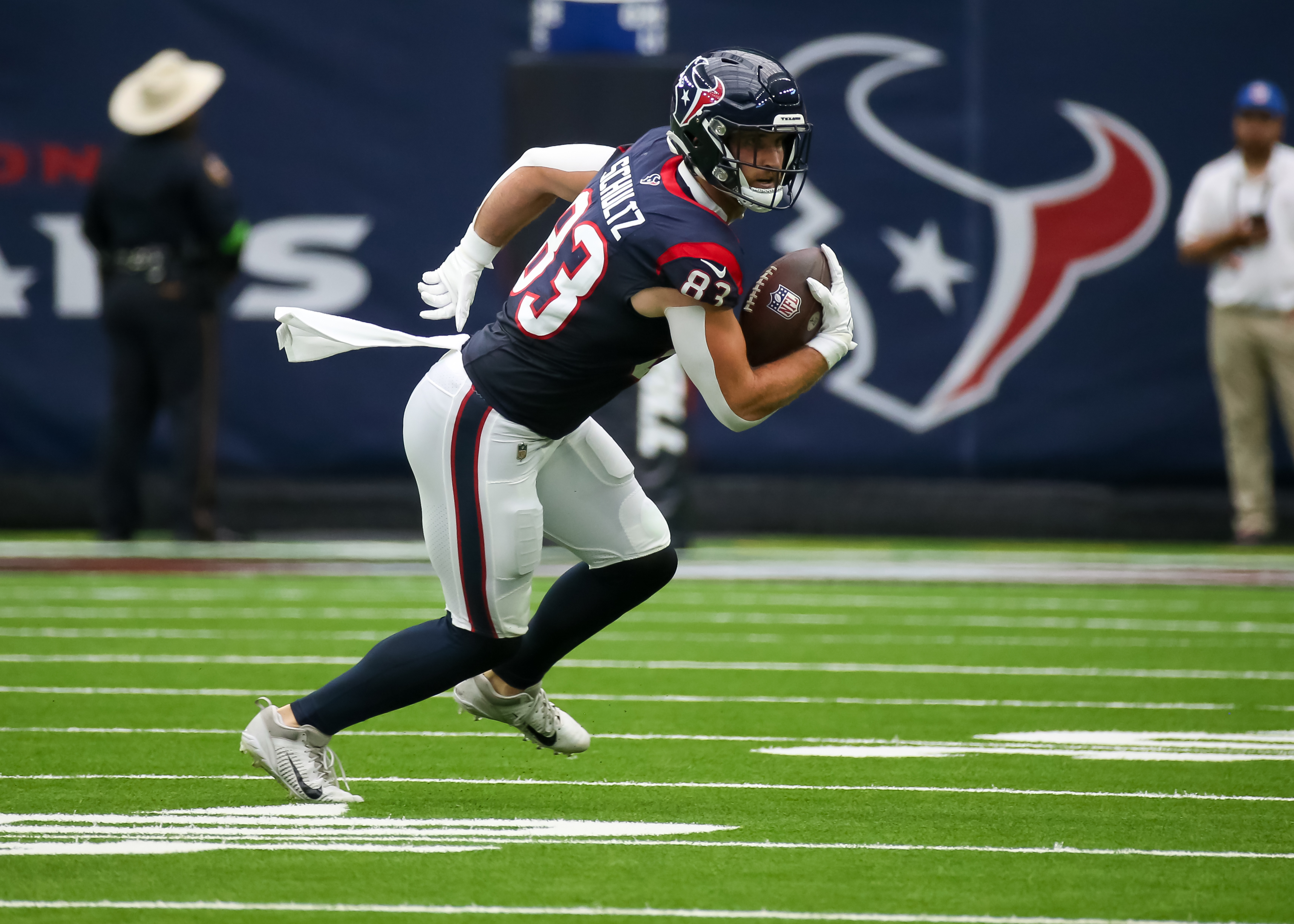 HOUSTON, TX - AUGUST 19: Houston Texans tight end Dalton Schultz (83) carries the ball in the second quarter during the preseason NFL game between the Miami Dolphins and Houston Texans on August 19, 2023 at NRG Stadium in Houston, Texas.