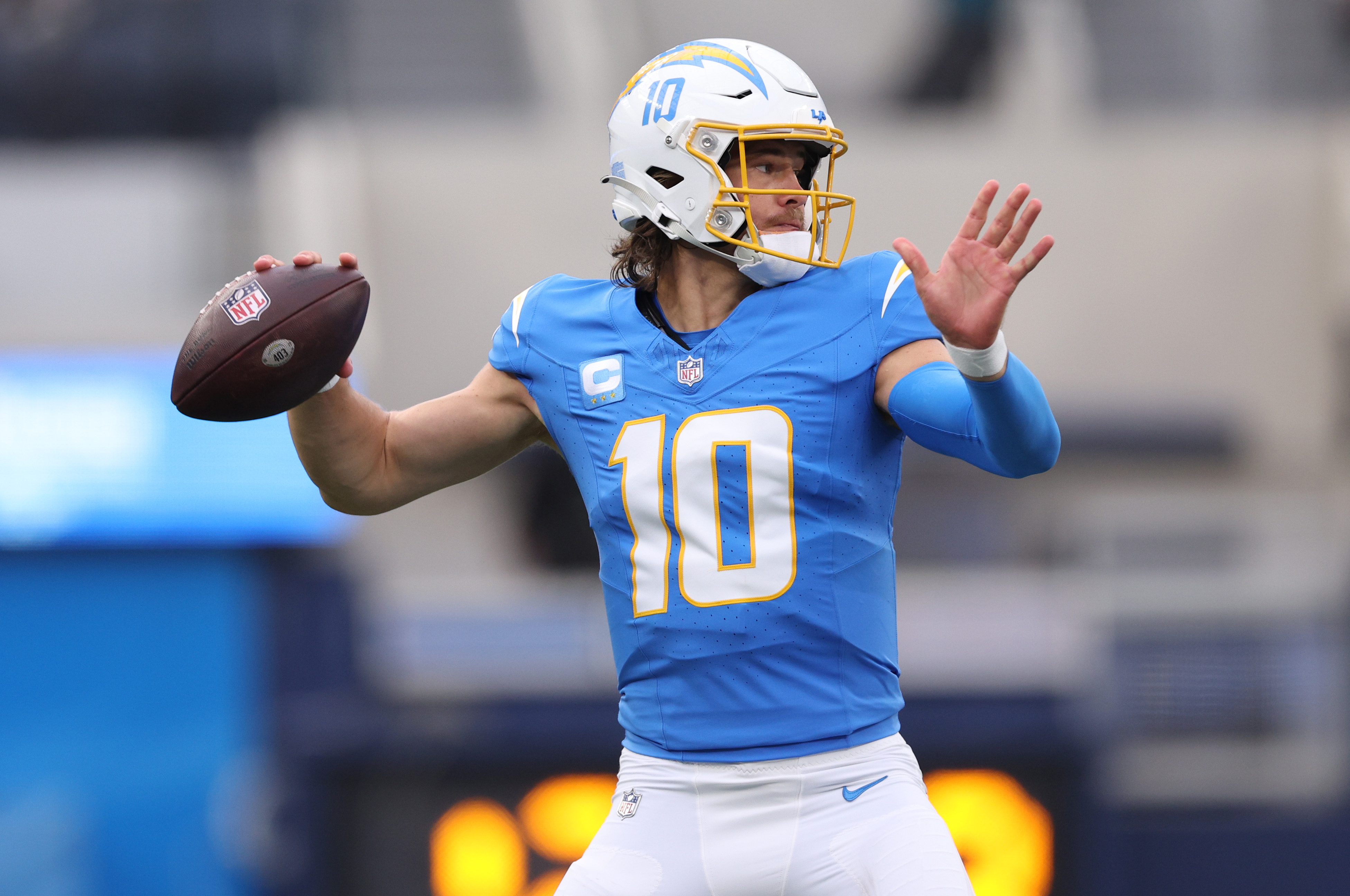 INGLEWOOD, CALIFORNIA - OCTOBER 01: Justin Herbert #10 of the Los Angeles Chargers throws a pass against the Las Vegas Raiders during the first half of the game at SoFi Stadium on October 01, 2023 in Inglewood, California.
