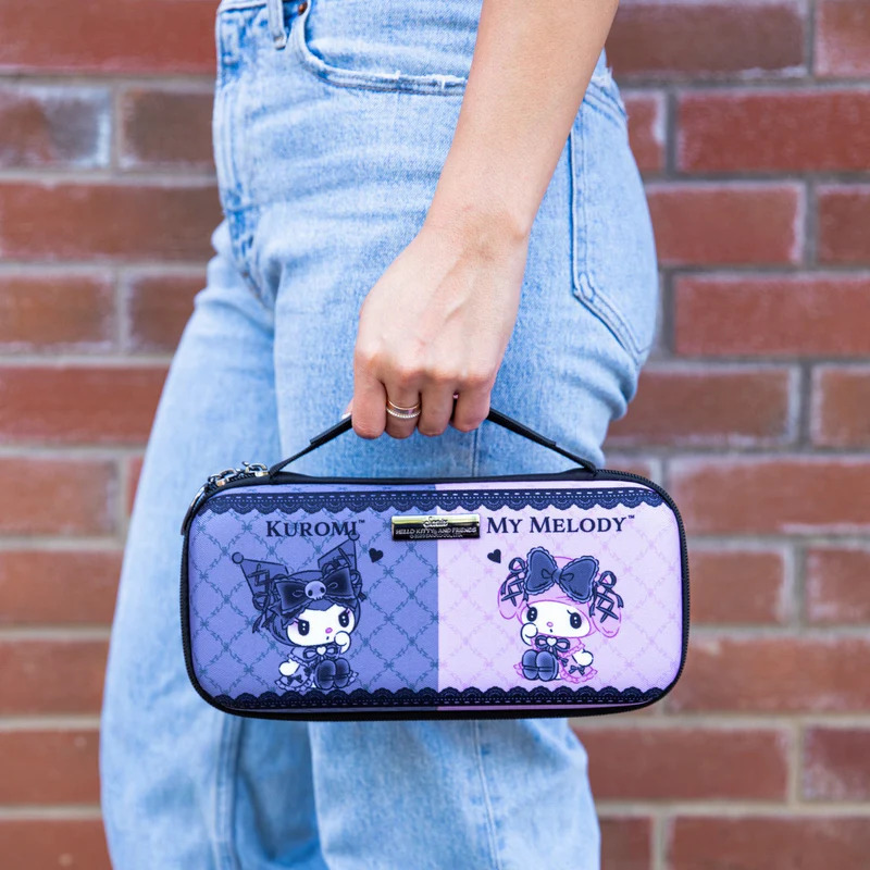 A person carrying a Nintendo Switch case featuring cute bunny characters in costumes, one side is purple and one side is pink. 