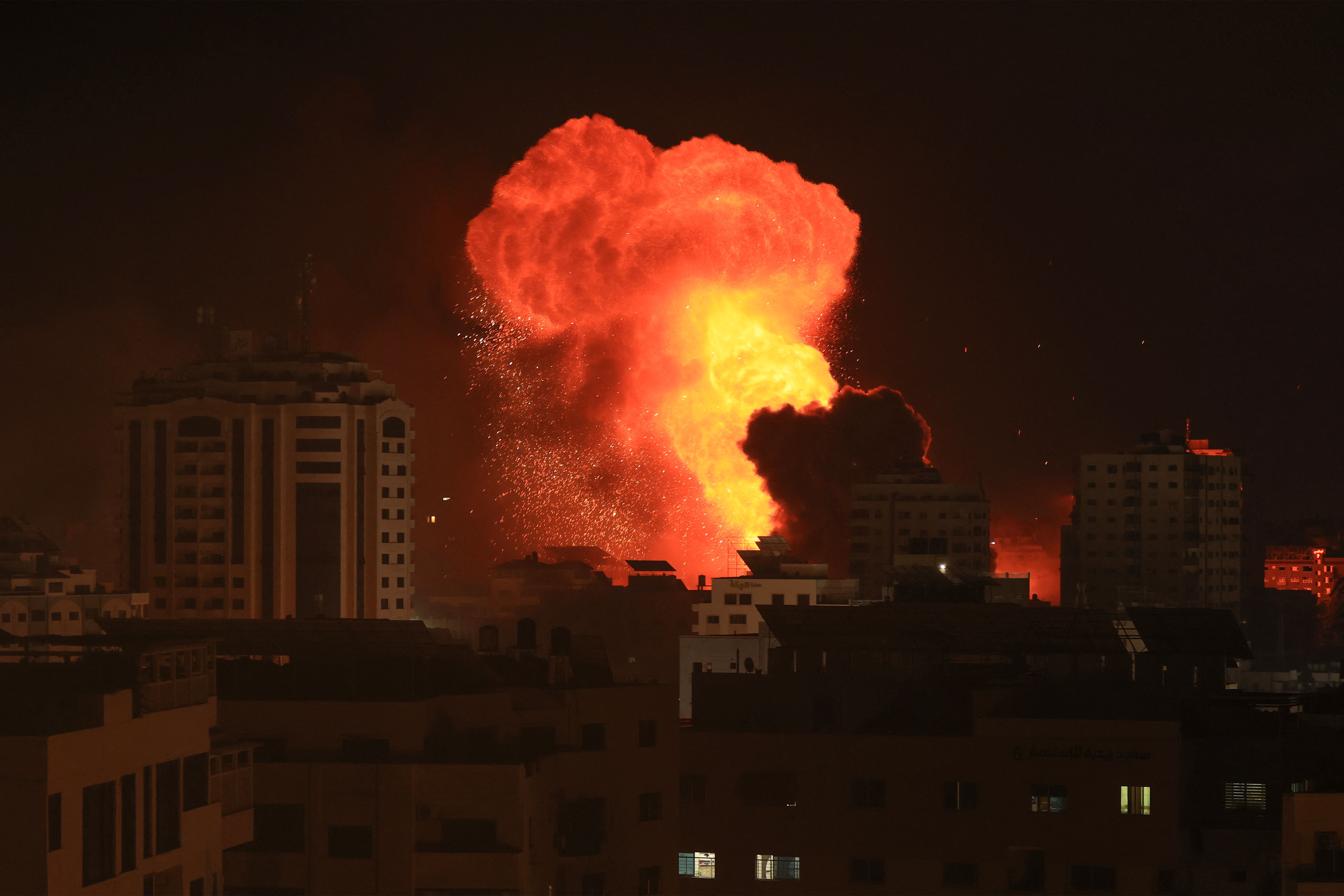 An explosion is seen at nighttime. 