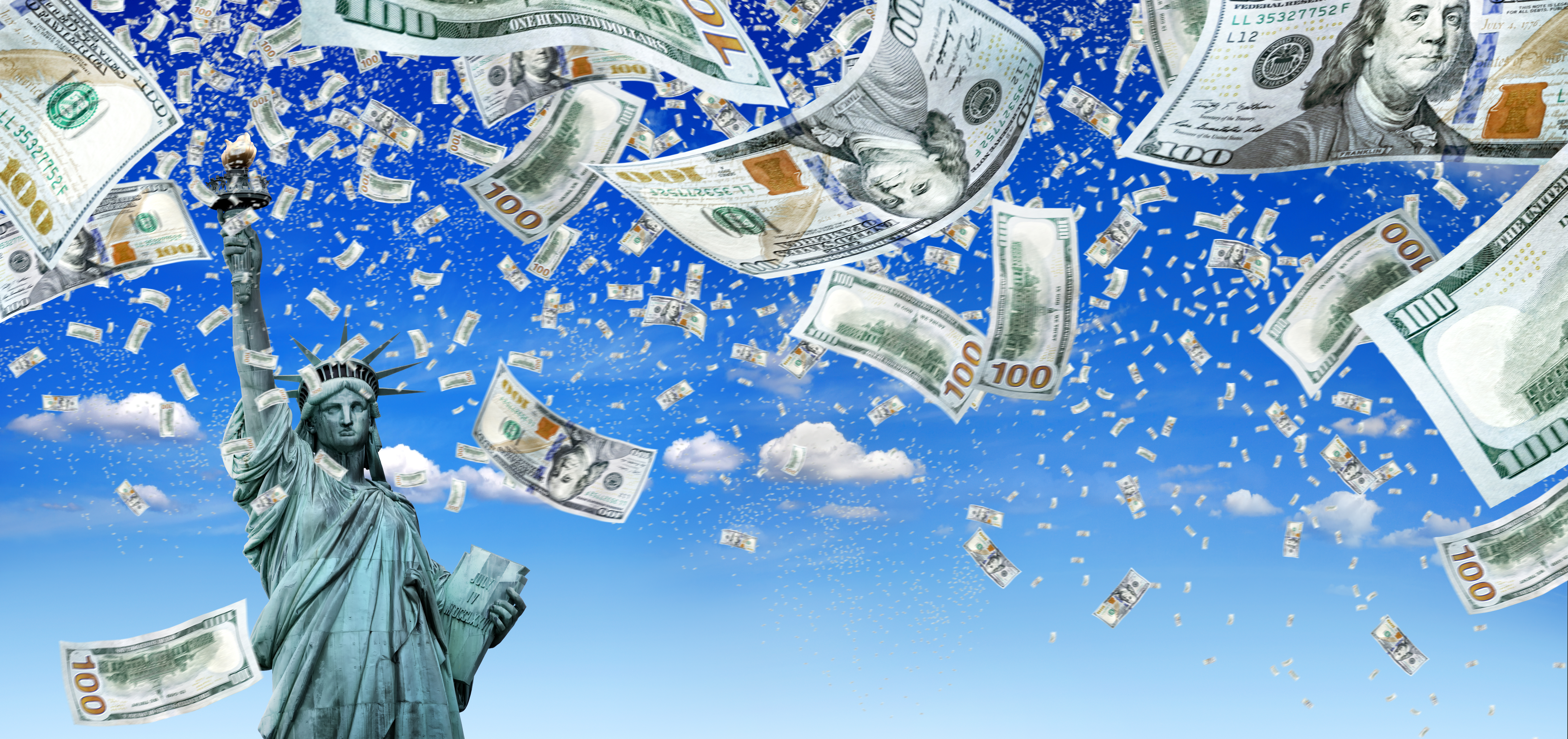 Statue of liberty under a sky of floating 100 dollar bills