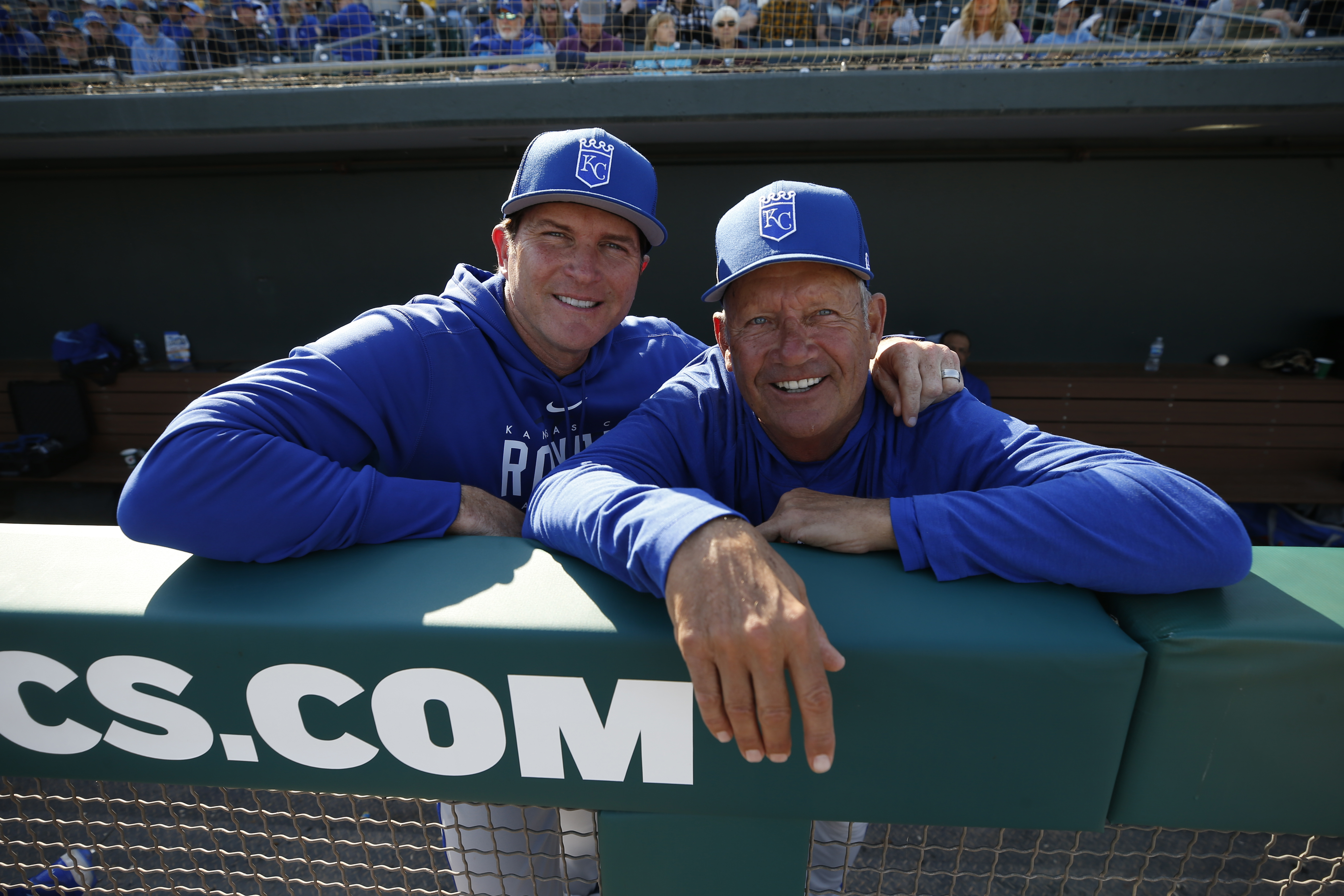 Pitching Coach Brian Sweeney #85 and Vice President of Baseball Operations George Brett of the Kansas City Royals in the dugout during a spring training game against the Oakland Athletics at Hohokam Stadium on March 3, 2023 in Mesa, Arizona. The Royals defeated the Athletics 6-4.