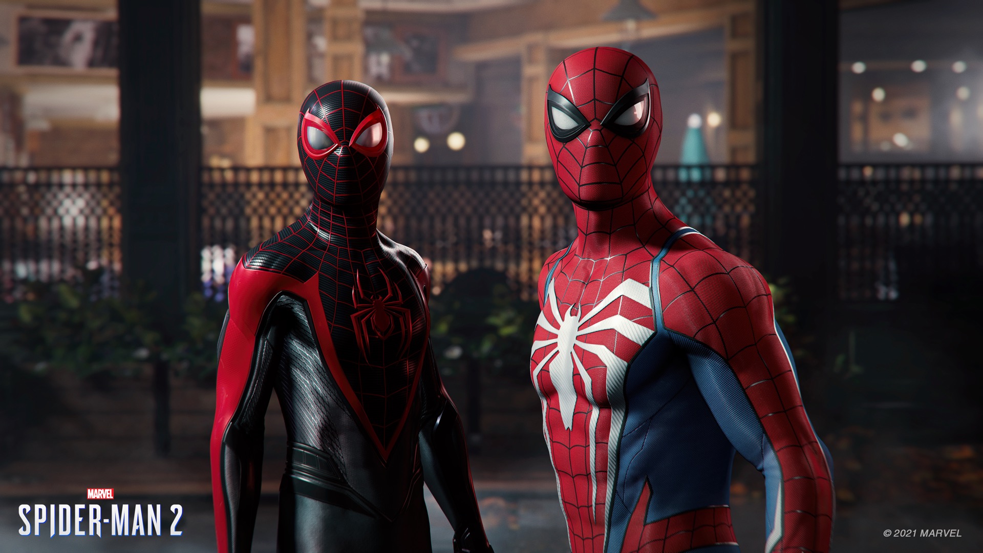 Miles Morales in his Spider-Man costume, and Peter Parker in his Spider-Man uniform, side-by-side.