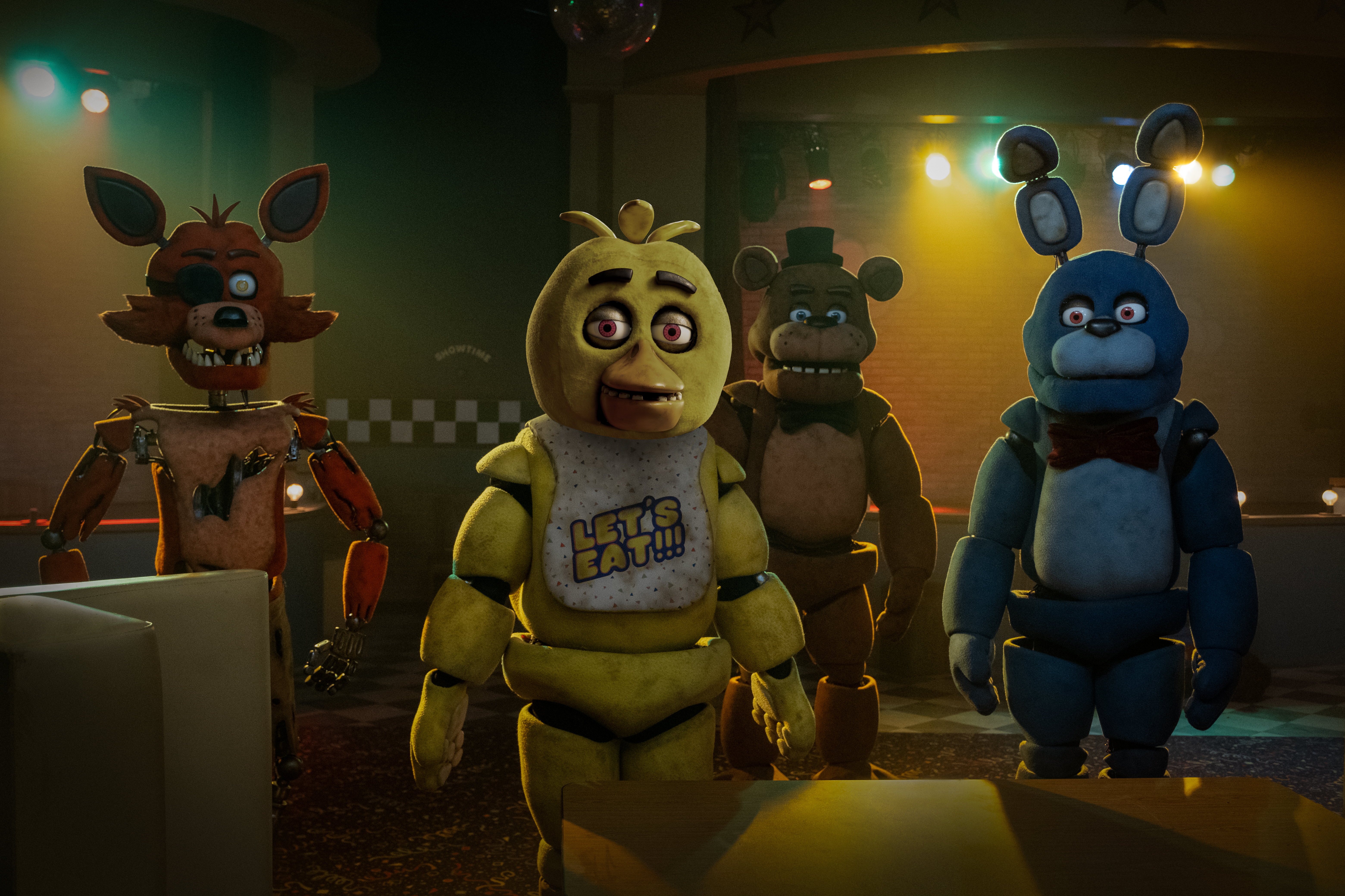 Five Nights at Freddy’s signature animatronics —&nbsp;Foxy, Chica, Freddy Fazbear, and Bonnie — lurk in the darkness in the movie spinoff