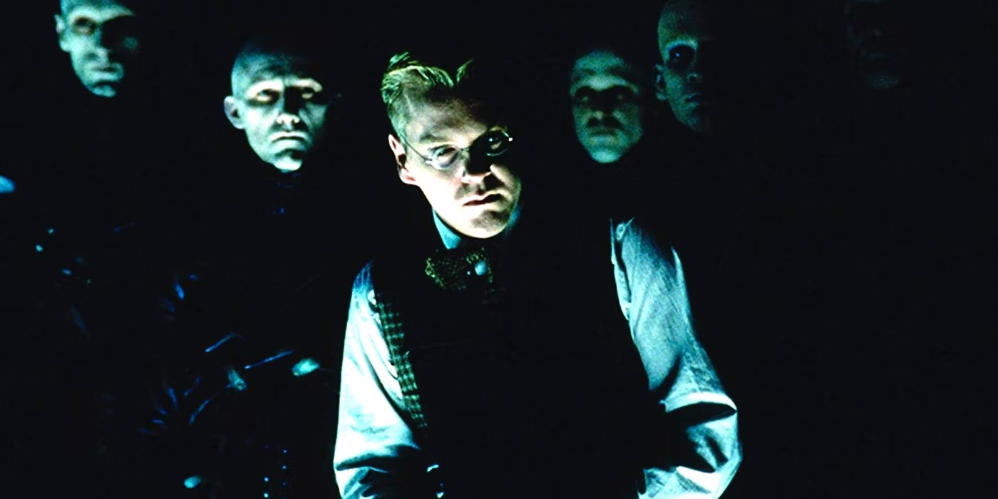 Kiefer Sutherland surrounded by creepy bald men in Dark City