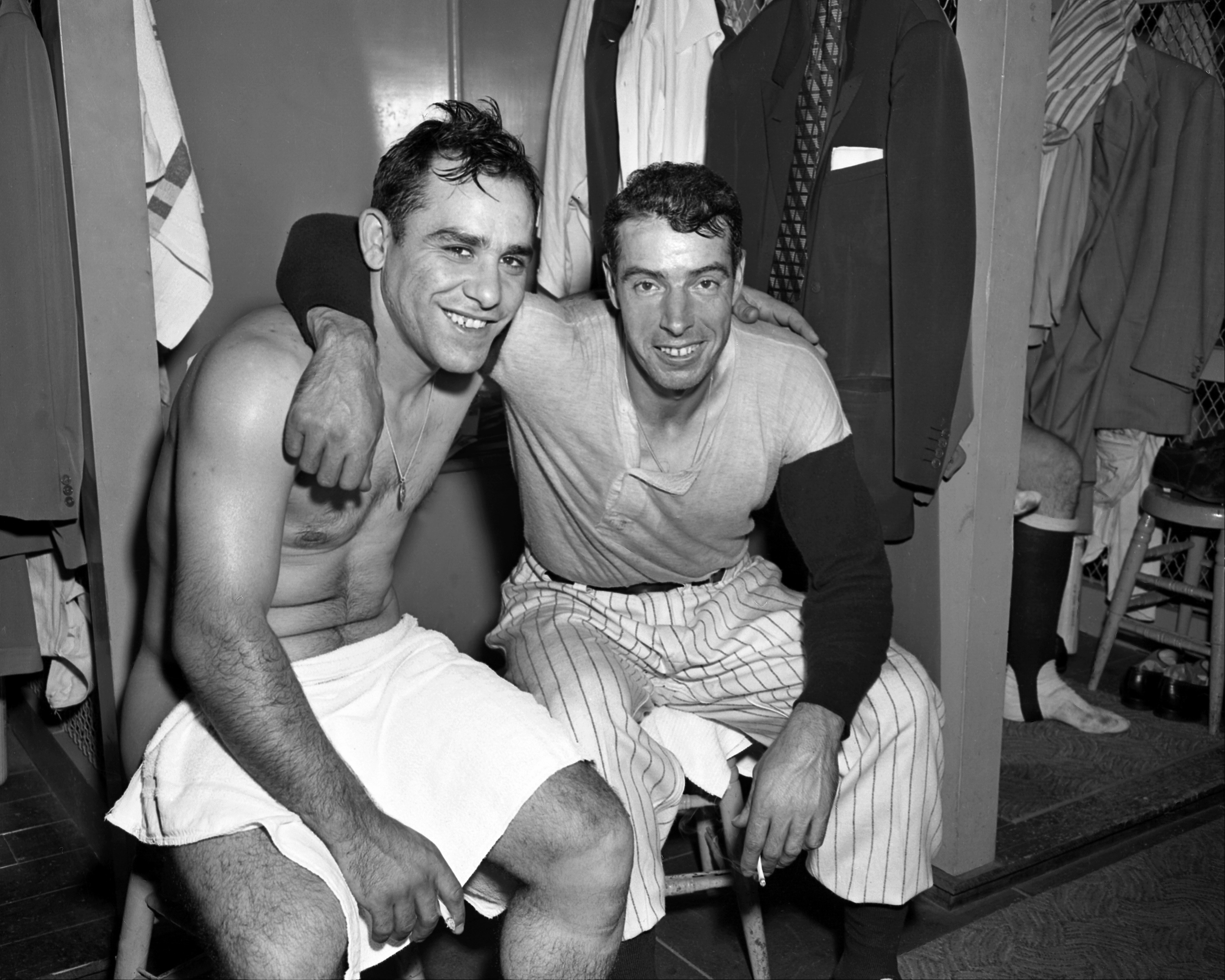 Yogi Berra and Joe DiMaggio celebrate at Stadium after Yankees sweep the Phillies in the 1950 World Series.