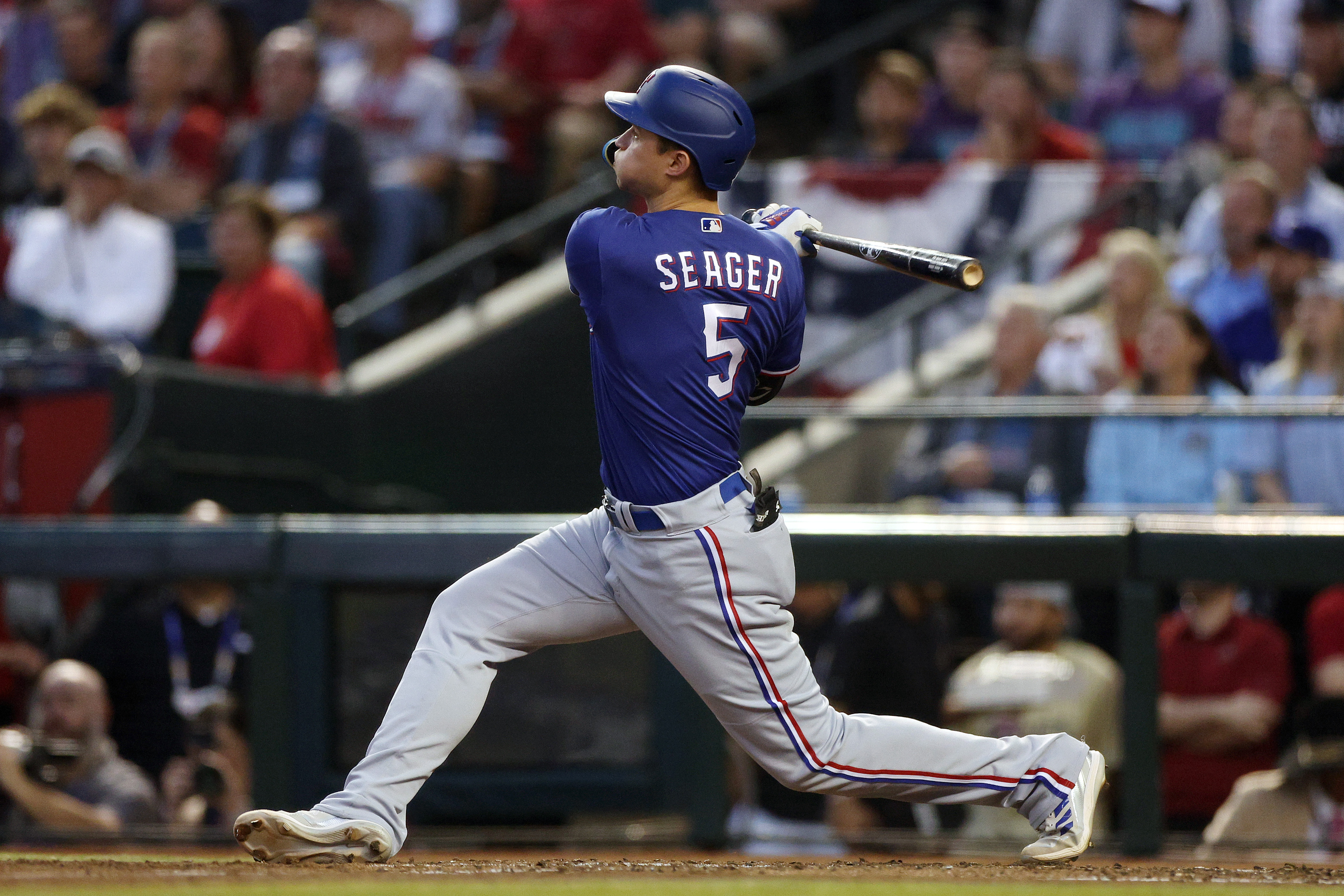 Corey Seager of the Texas Rangers hits a home run in the third inning against the Arizona Diamondbacks during Game Three of the World Series at Chase Field on October 30, 2023 in Phoenix, Arizona.
