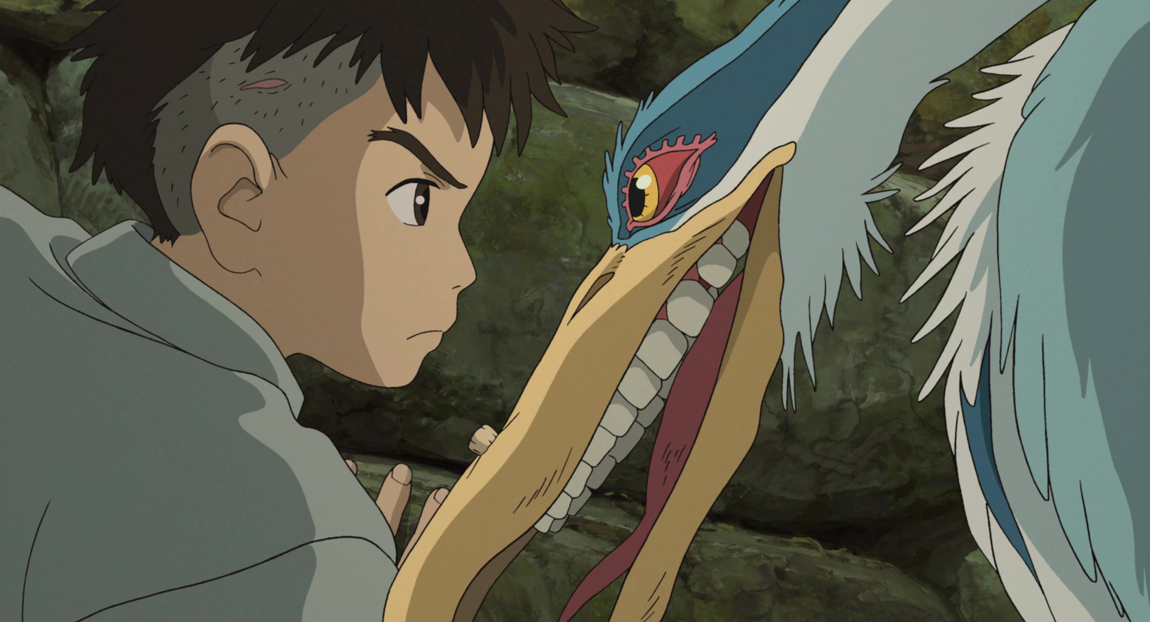 Mahito and a grey heron with disturbing human teeth glare at each other face to face in Hayao Miyazaki’s anime movie The Boy and the Heron