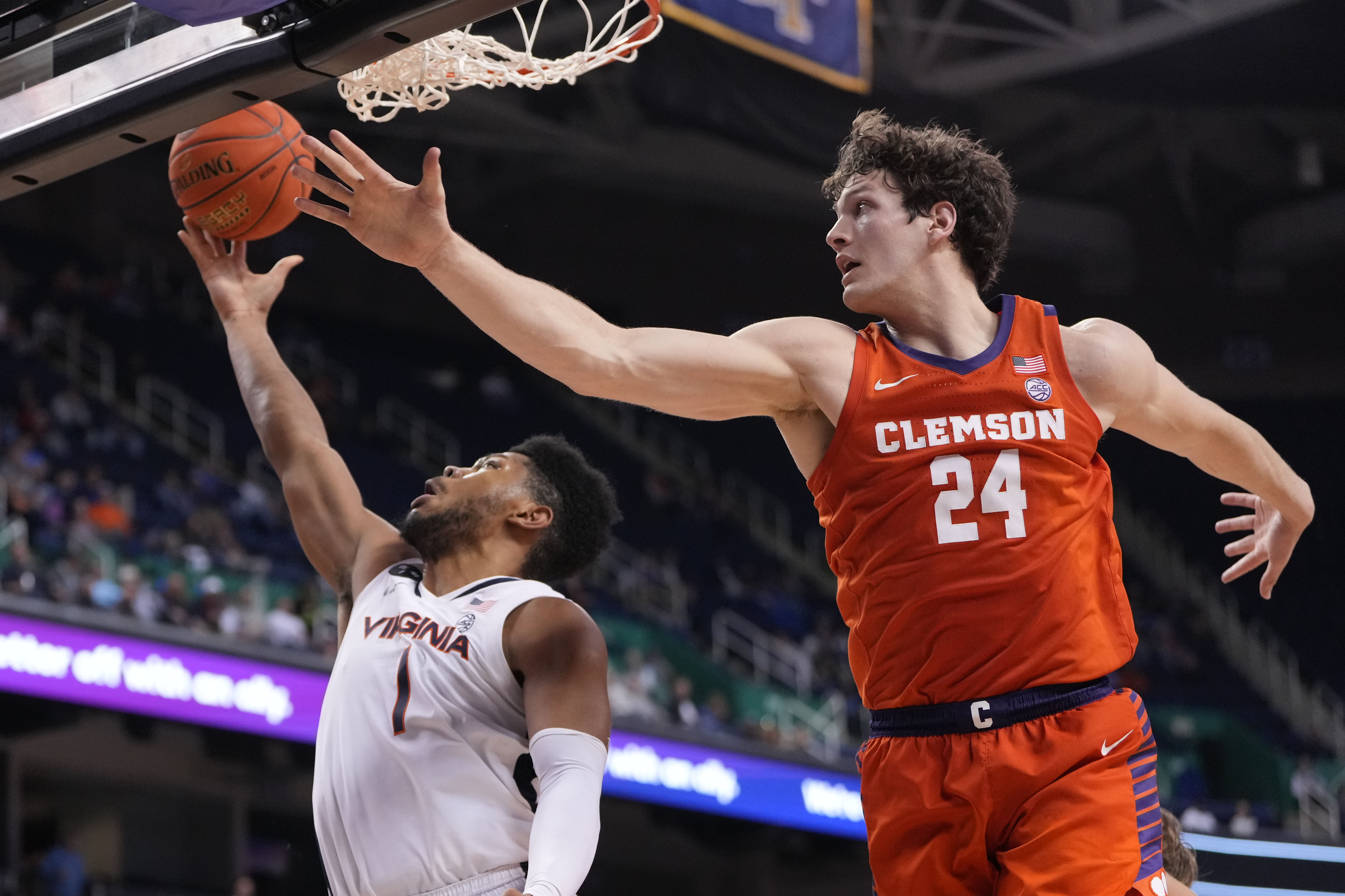 Mar 10, 2023; Greensboro, NC, USA; Virginia Cavaliers forward Jayden Gardner (1) shoots as Clemson Tigers center PJ Hall (24) defends in the second half during the semifinals of the ACC Tournament at Greensboro Coliseum.