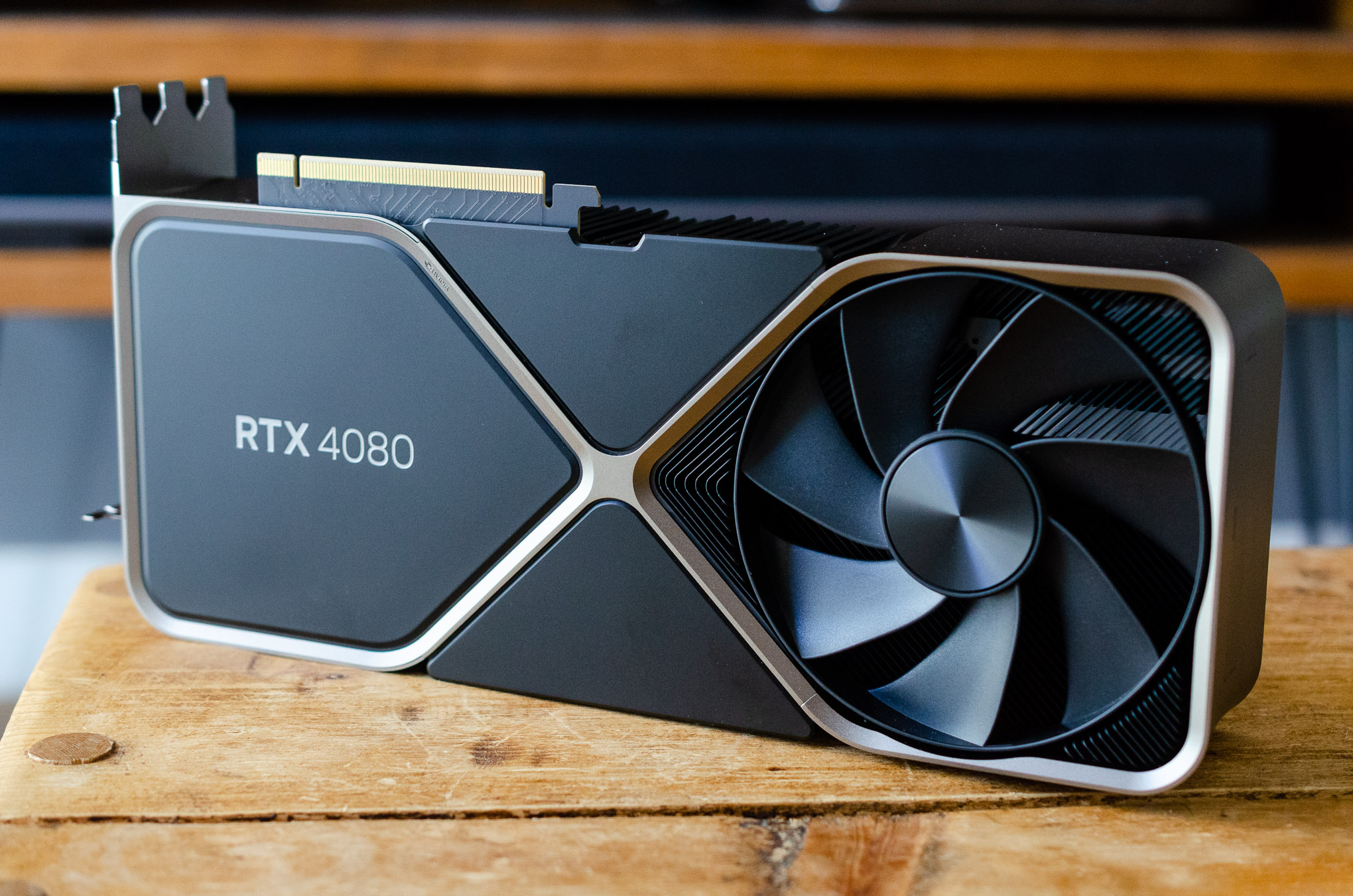 Nvidia’s RTX 4080 Founders Edition GPU on a wooden table