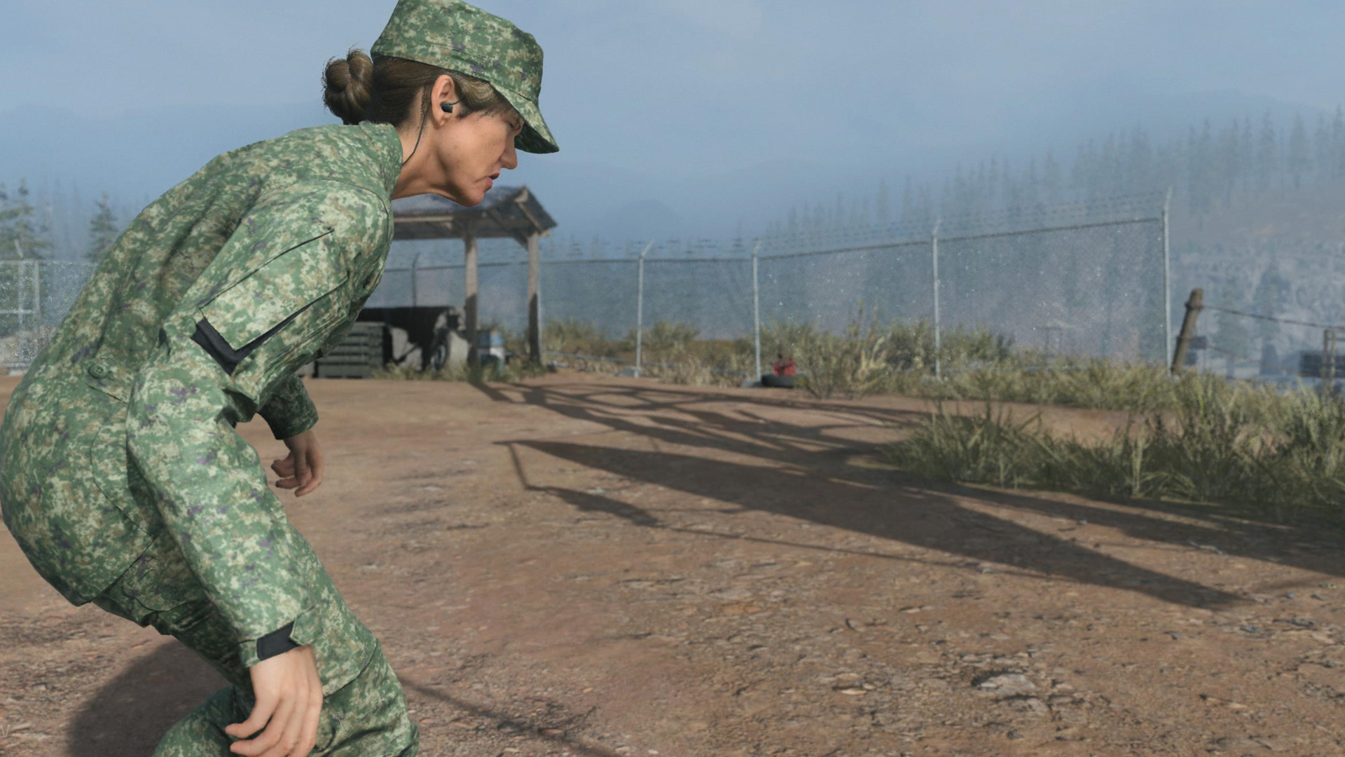 A spy sneaks toward a fence in a miitary compound during Deep Cover in MW3.