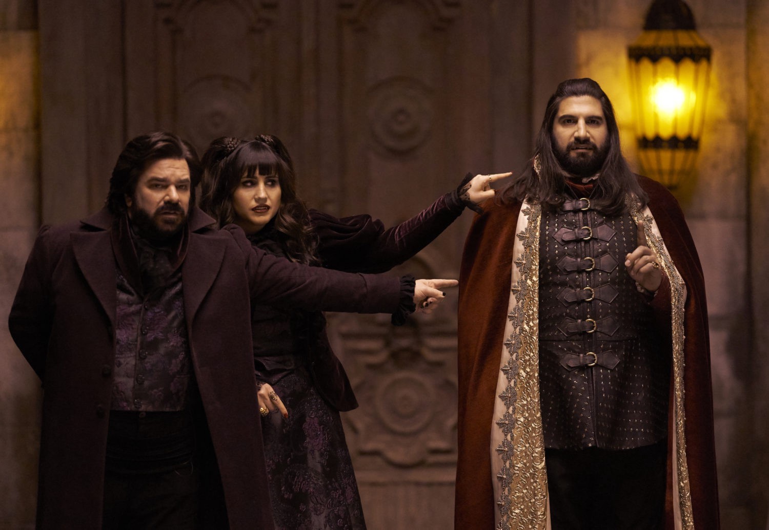 Laszlo and Nadja point at Nandor in What We Do in the Shadows TV series