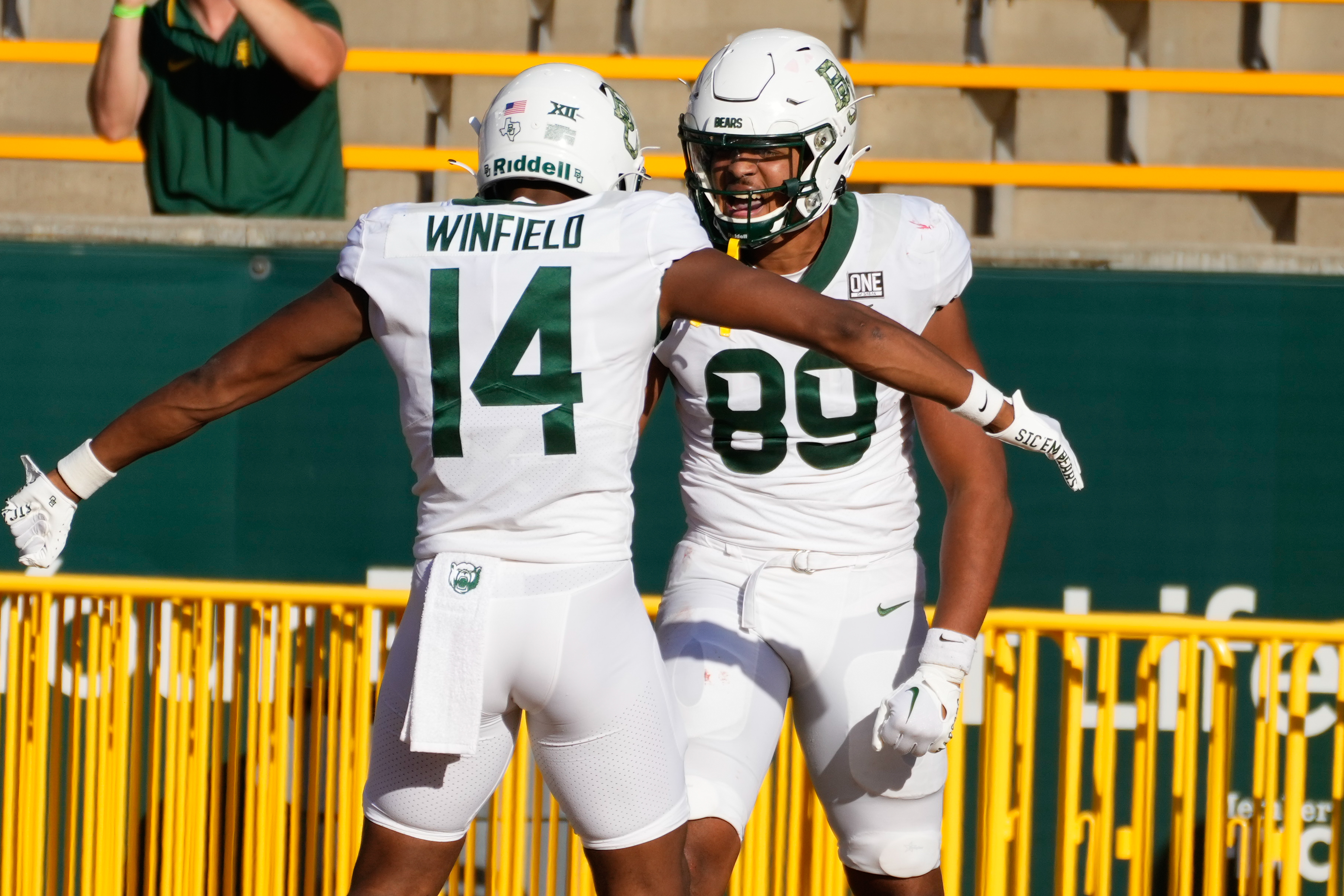 Nov 4, 2023; Waco, Texas, USA; Baylor Bears tight end Drake Dabney (89) celebrates with Baylor Bears wide receiver Armani Winfield (14) after scoring a touchdown against the Houston Cougars during the second half at McLane Stadium.