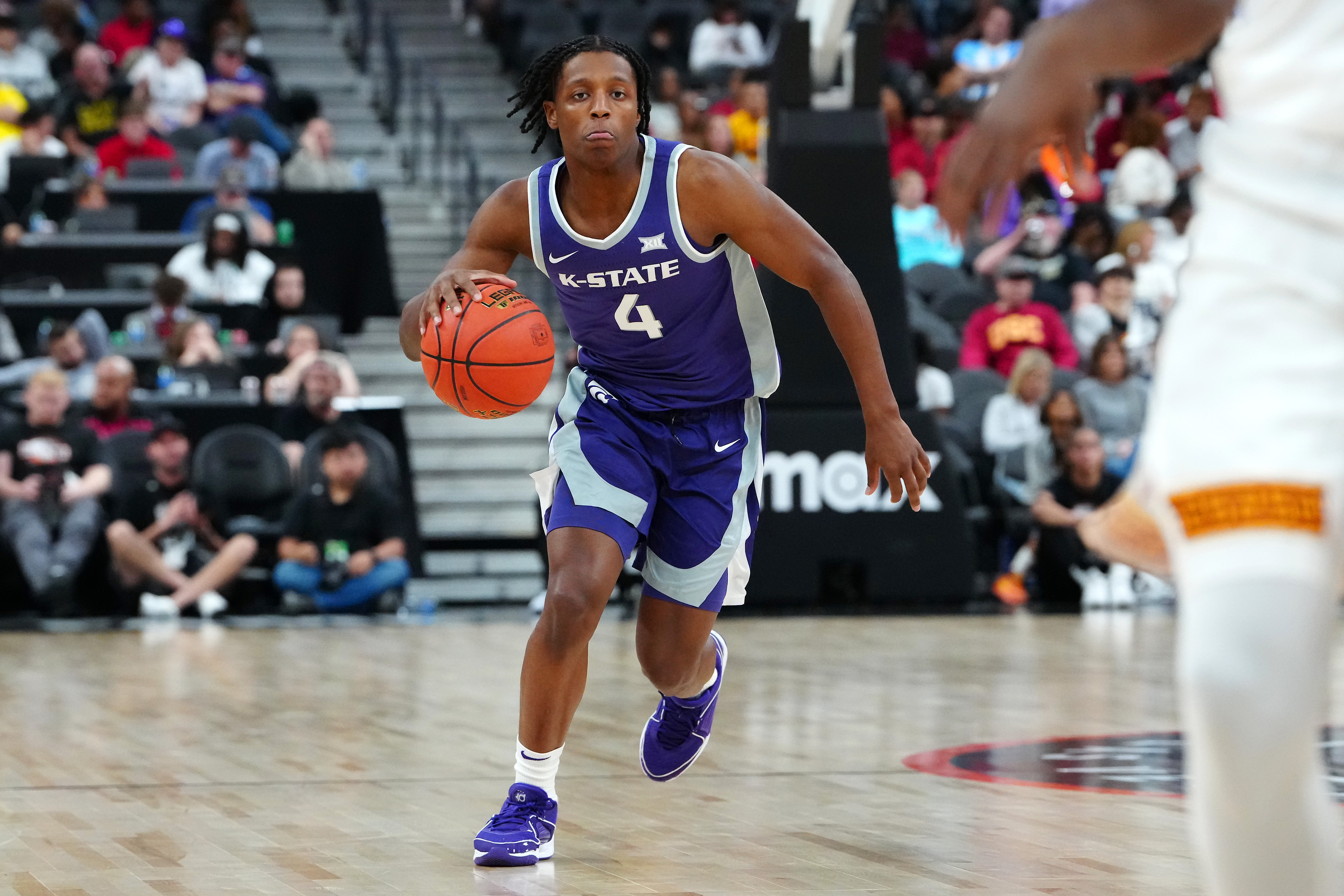 Nov 6, 2023; Las Vegas, Nevada, USA; Kansas State Wildcats guard Darrin Ames (4) dribbles against the USC Trojans during the second half at T-Mobile Arena.