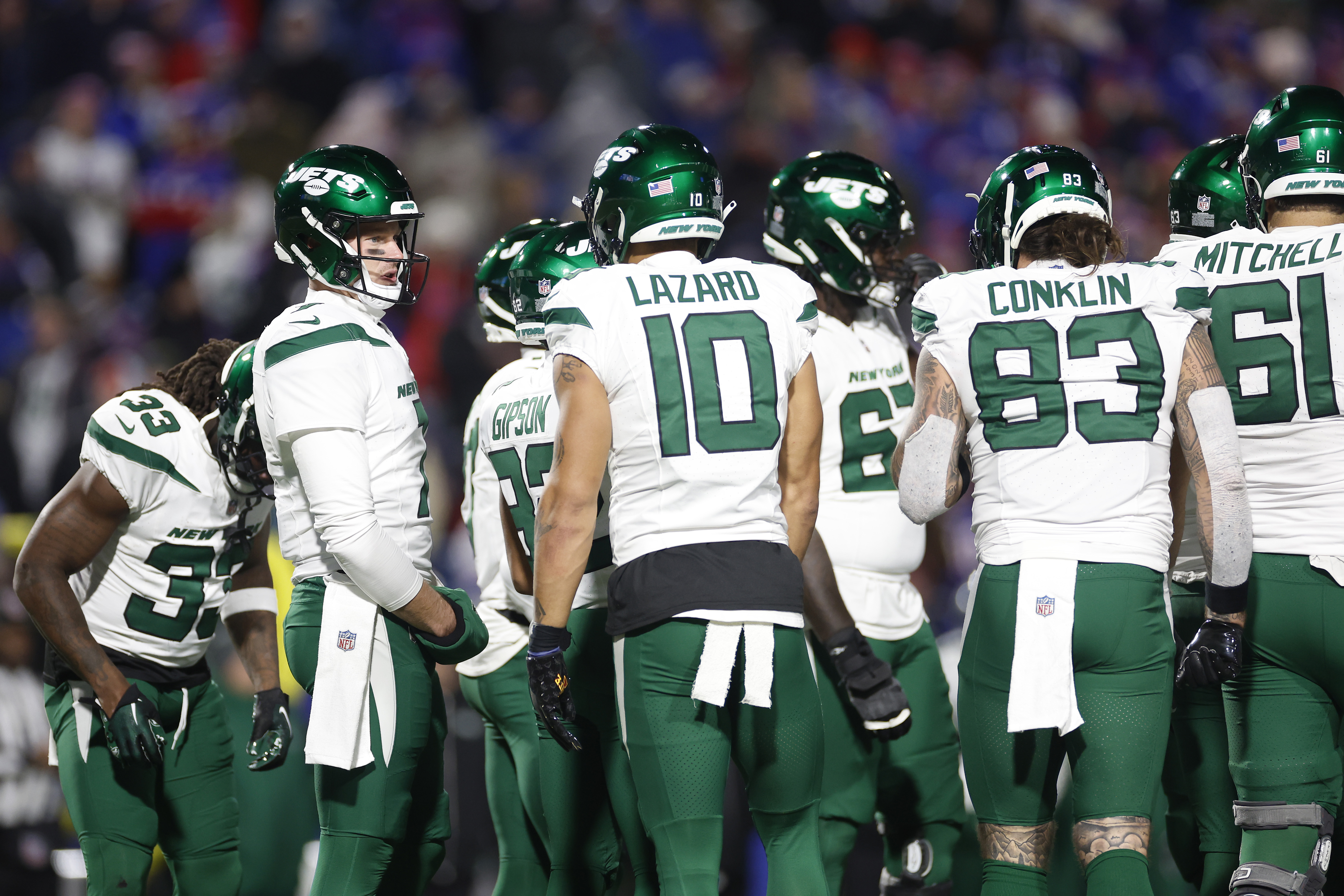 Tim Boyle of the New York Jets huddles with the team in the fourth quarter against the Buffalo Bills at Highmark Stadium on November 19, 2023 in Orchard Park, New York.