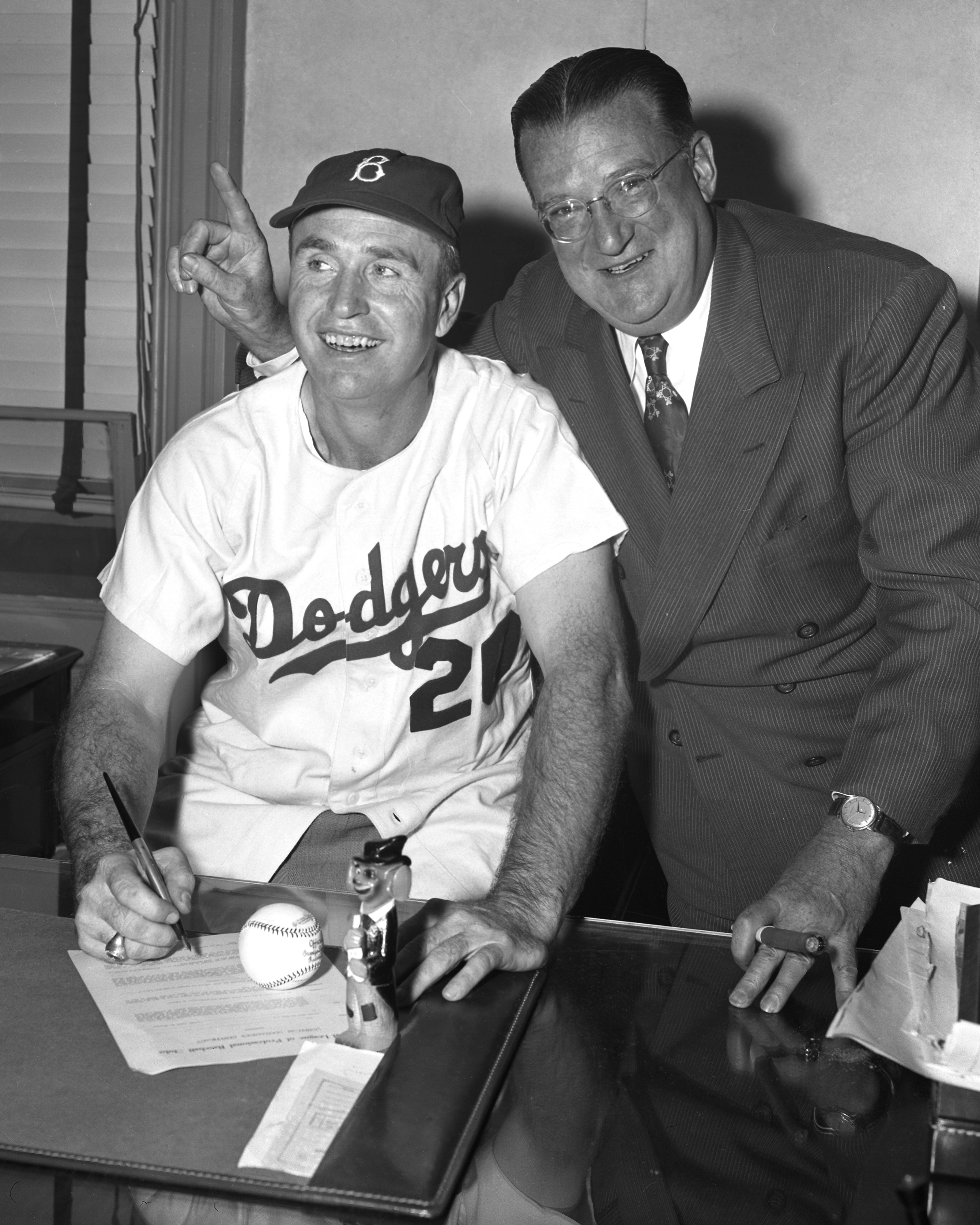 Walt Alston, when he was hired as Brooklyn Dodgers manager on November 24, 1953 (wearing No. 20), along with team owner Walter O’Malley.
