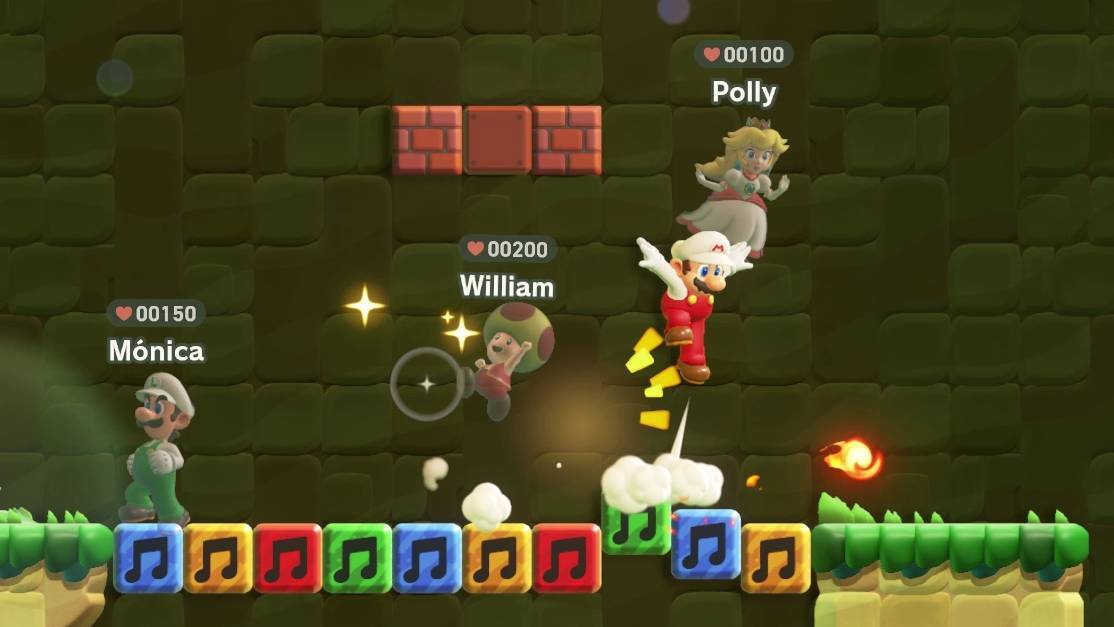 A view of four players playing Super Mario Bros. Wonder online: the local player is Mario, while Luigi, Toad, and Peach appear see-through, with names over their heads