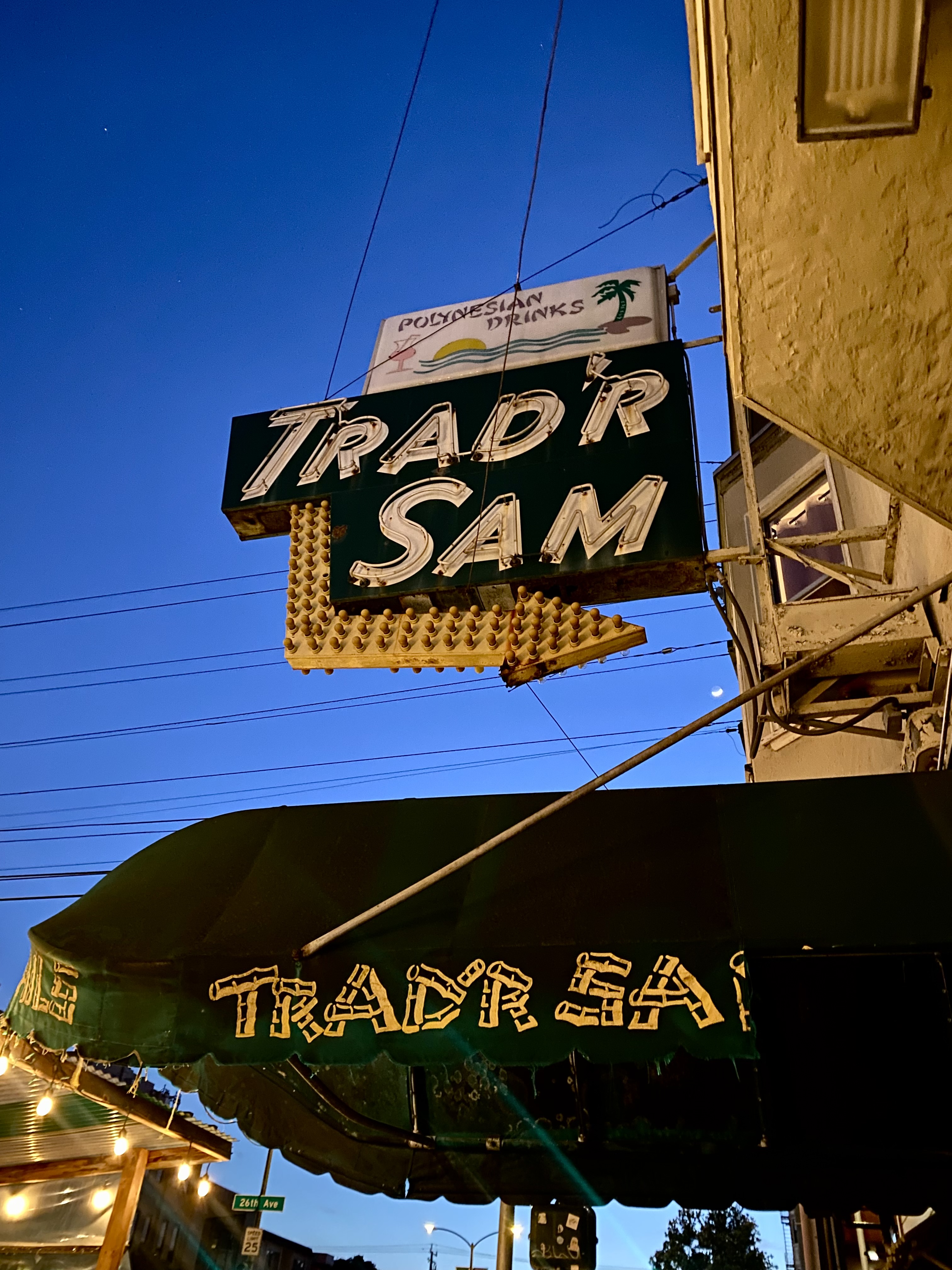 A sign that reads “Trad’r Sam.”