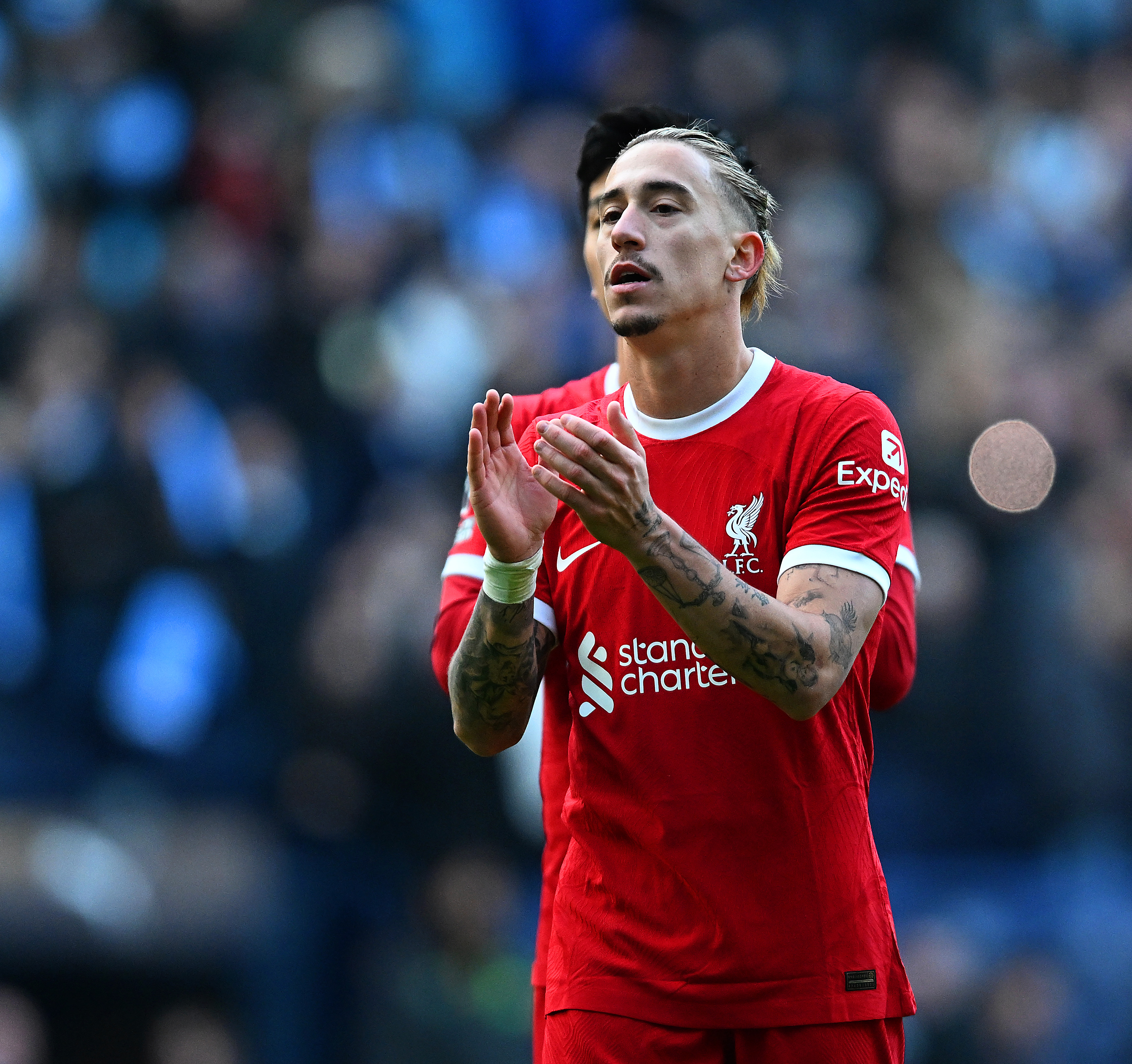 Kostas Tsimikas of Liverpool showing his appreciation to the fans at the end of the Premier League match between Manchester City and Liverpool FC at Etihad Stadium on November 25, 2023 in Manchester, England.