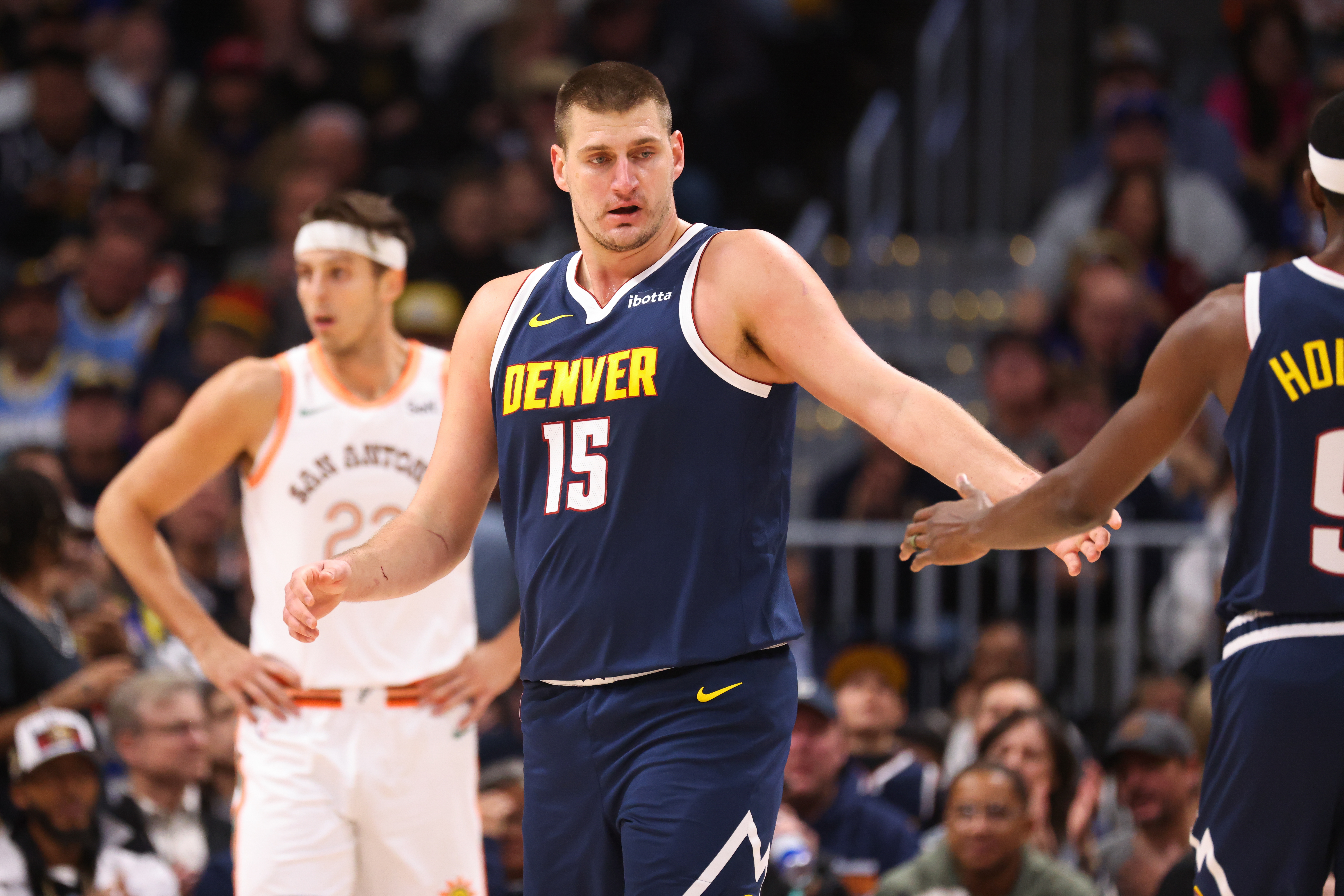 Nikola Jokic #15 of the Denver Nuggets reacts after a play against the San Antonio Spurs in the first half at Ball Arena on November 26, 2023 in Denver, Colorado.