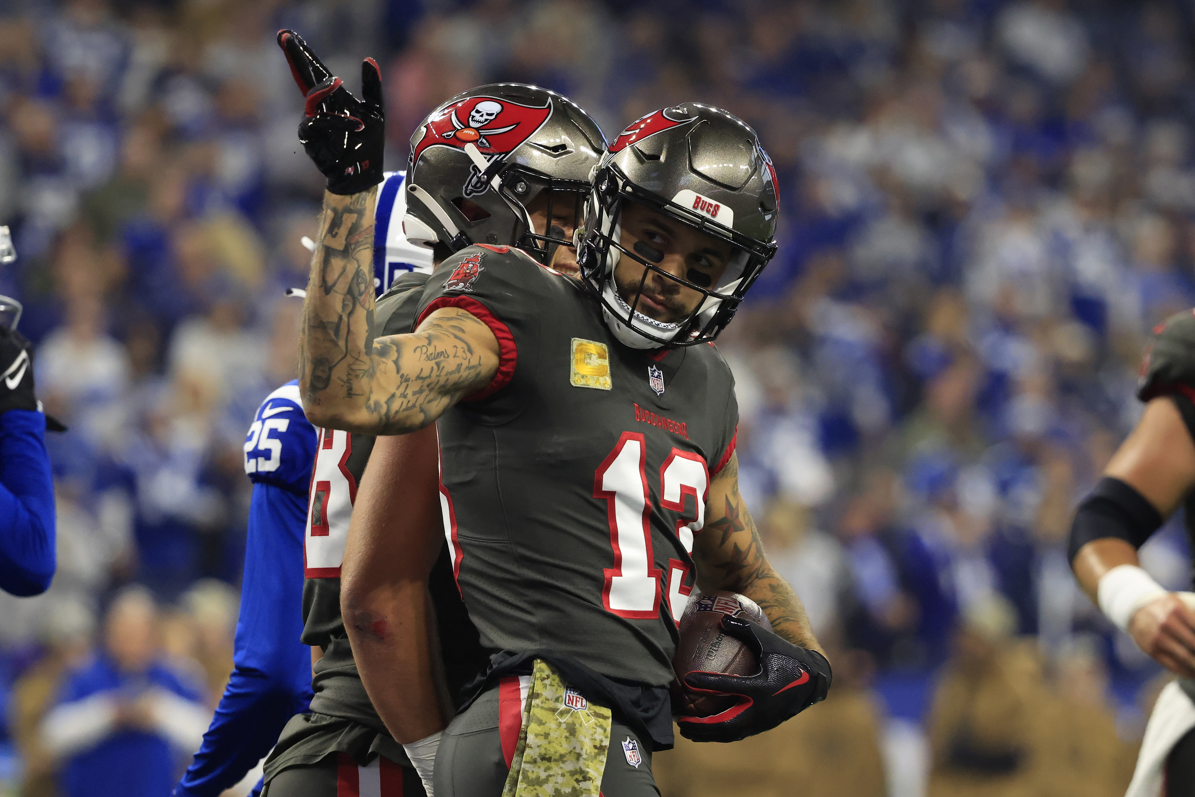 Mike Evans #13 of the Tampa Bay Buccaneers reacts after a first down catch at Lucas Oil Stadium on November 26, 2023 in Indianapolis, Indiana.
