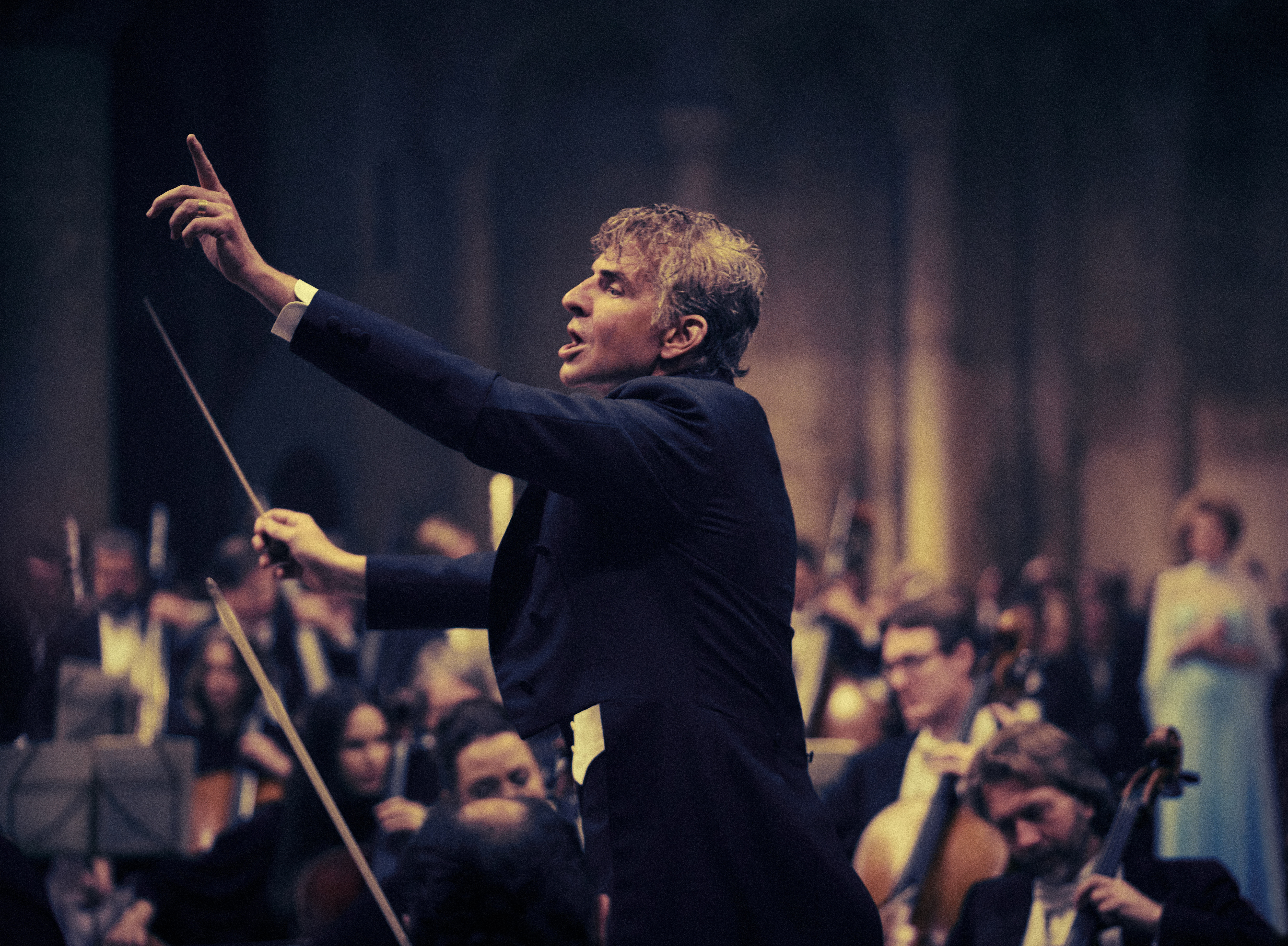 Bradley Cooper passionately conducting as Leonard Bernstein in Netflix’s Maestro