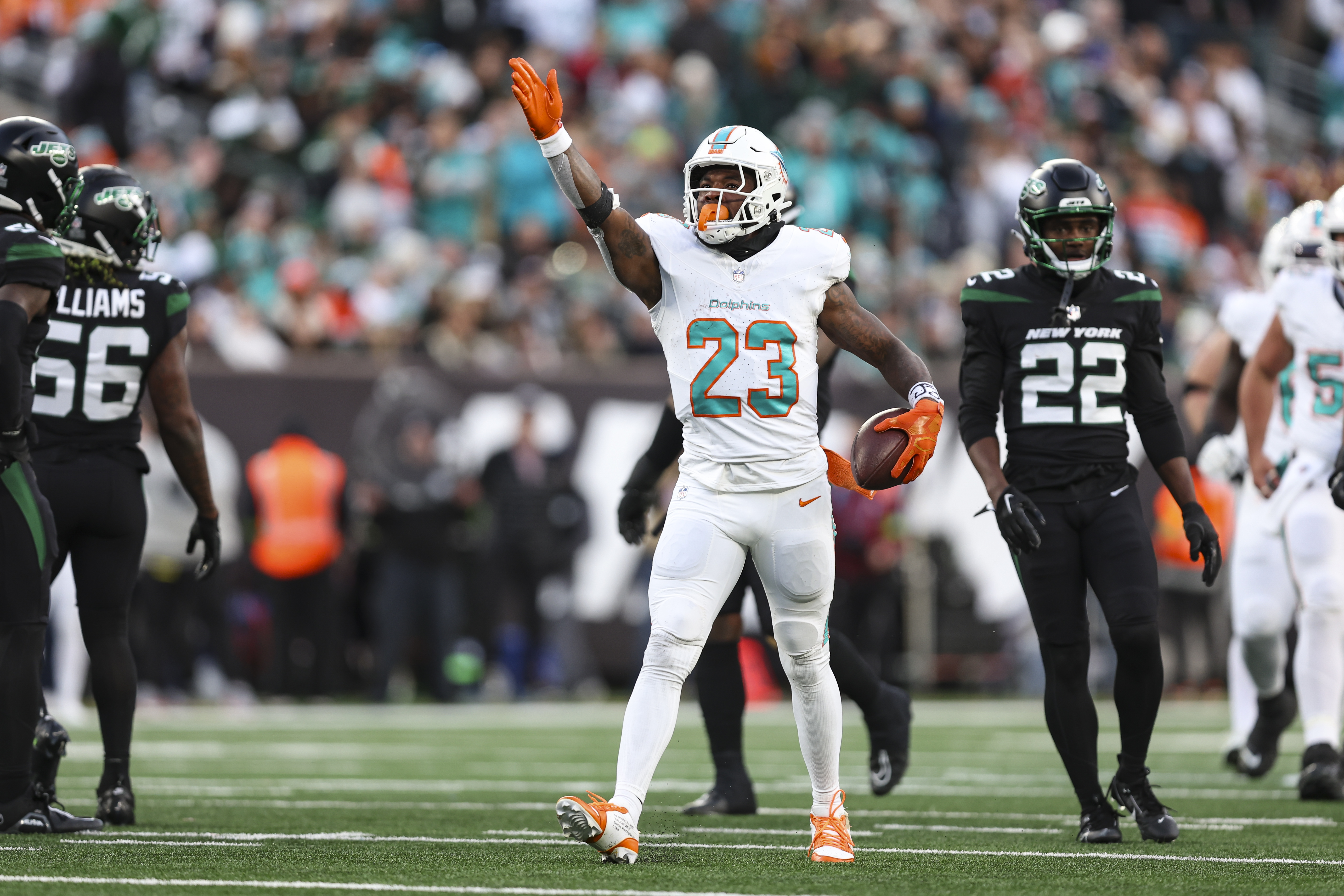EAST RUTHERFORD, NJ - NOVEMBER 24: Jeff Wilson Jr. #23 of the Miami Dolphins celebrates during an NFL football game against the New York Jets at MetLife Stadium on November 24, 2023 in East Rutherford, New Jersey.