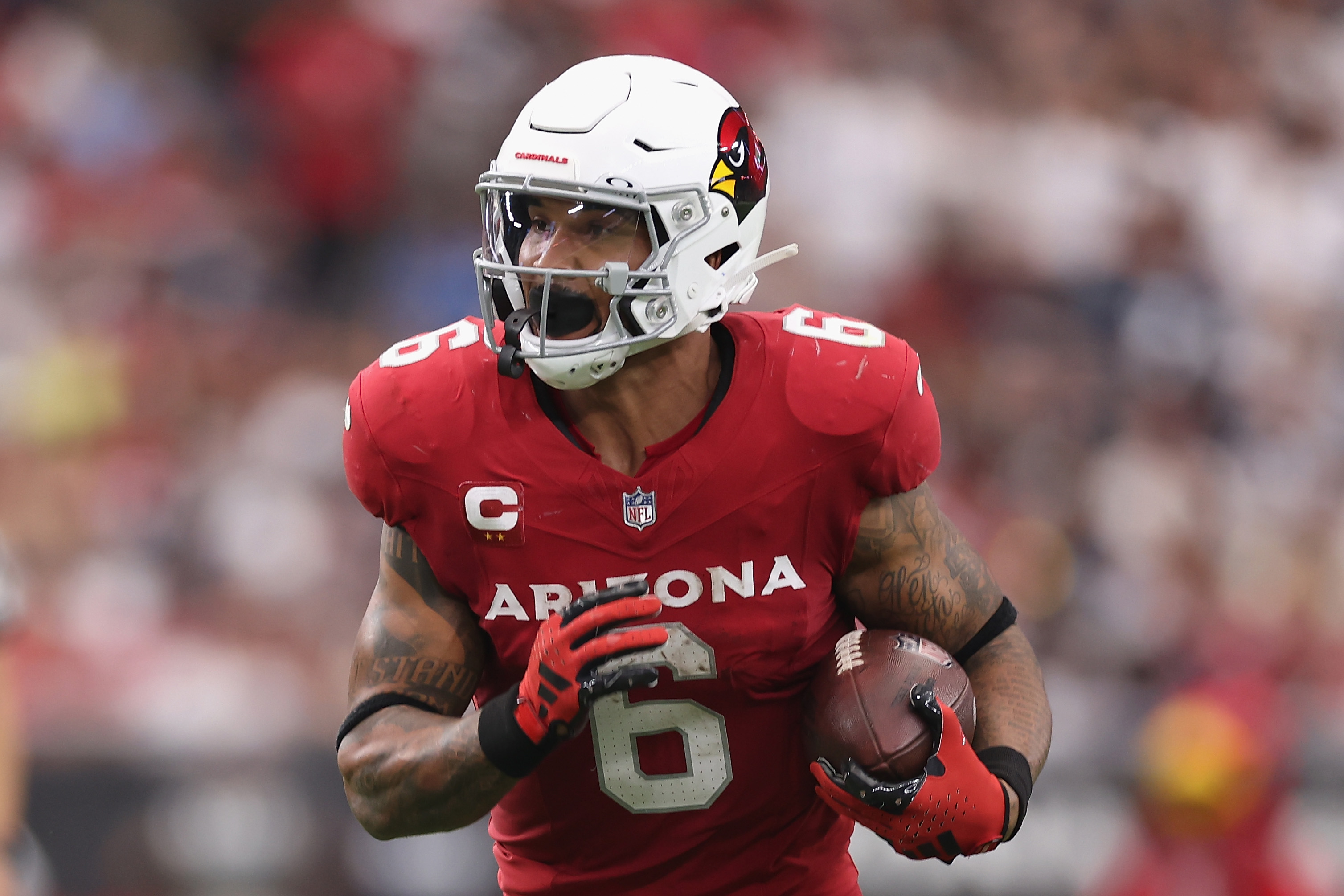 Running back James Conner #6 of the Arizona Cardinals rushes the football against the Dallas Cowboys during the NFL game at State Farm Stadium on September 24, 2023 in Glendale, Arizona. The Cardinals defeated the Cowboys 28-16.