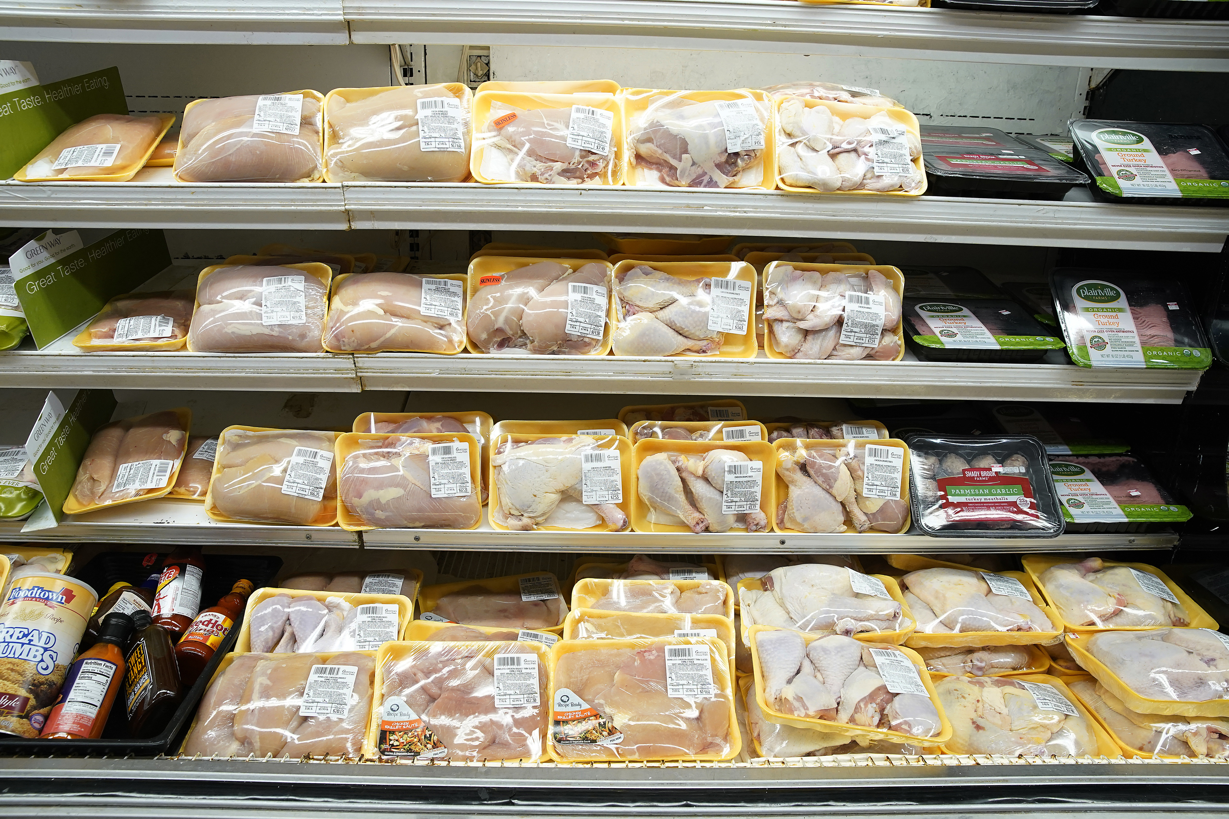 Poultry packages are seen in a supermarket refrigerator in...