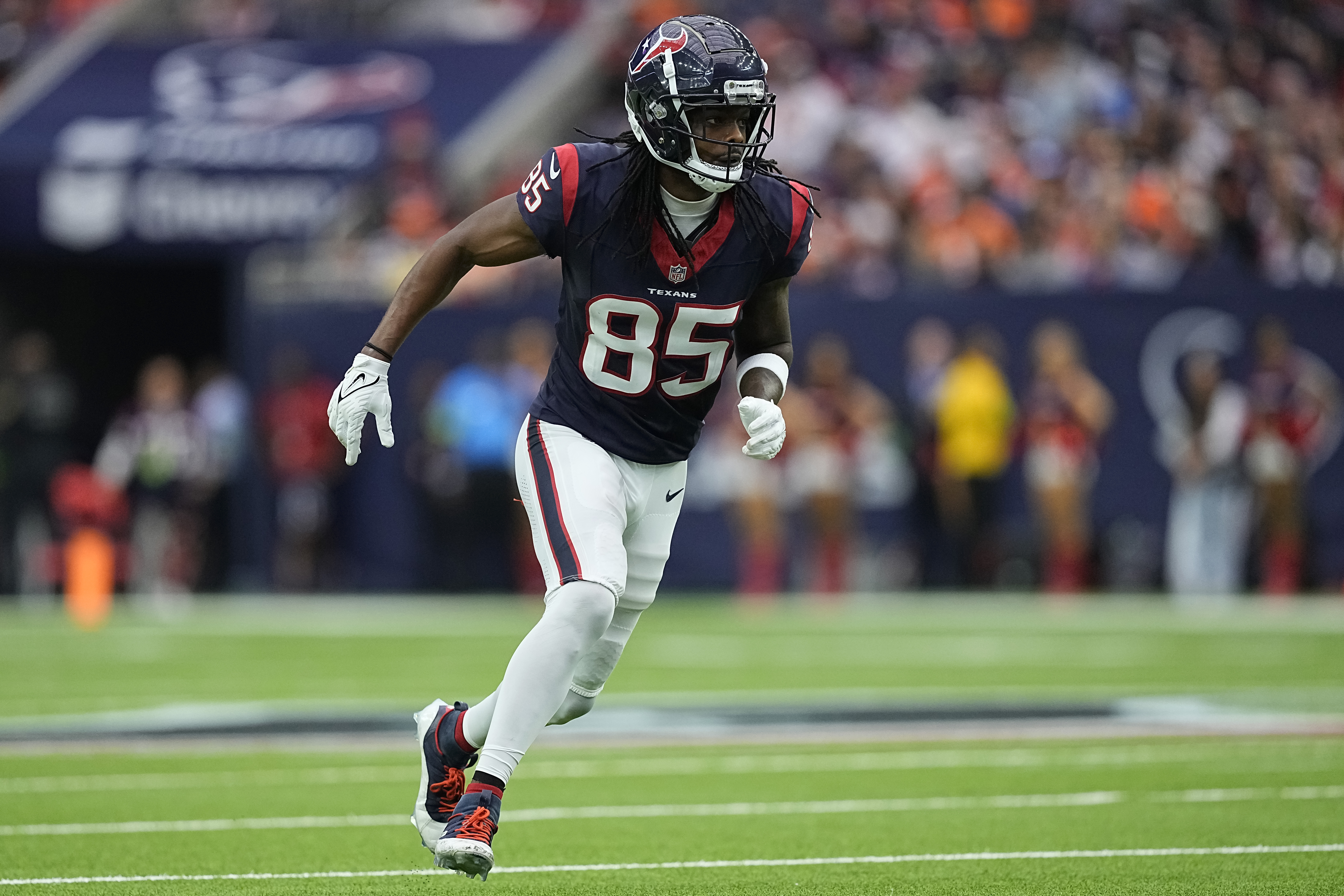 Noah Brown of the Houston Texans runs during the first half against the Denver Broncos at NRG Stadium on December 03, 2023 in Houston, Texas.