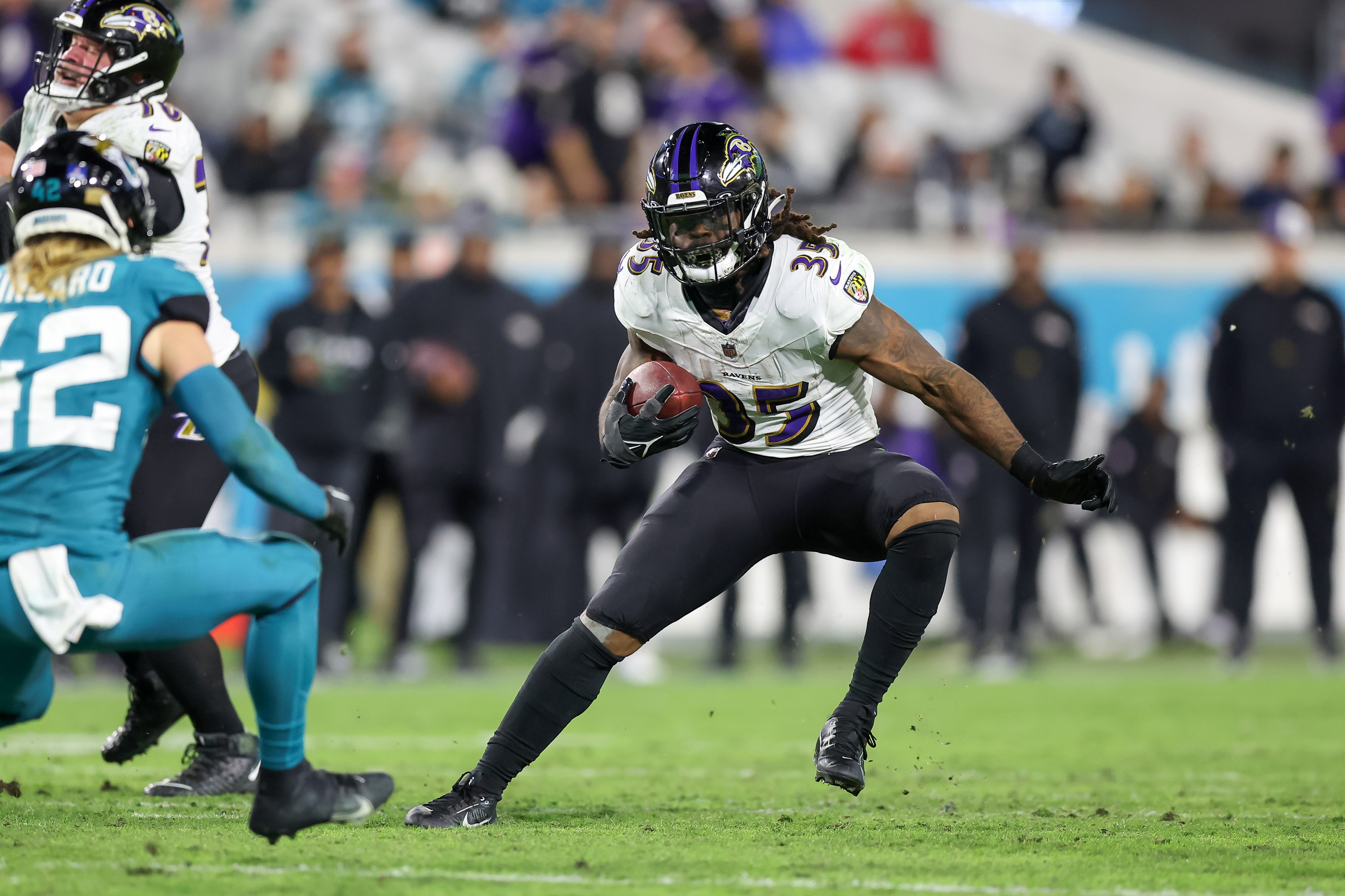 Gus Edwards of the Baltimore Ravens runs during the second half of the game against the Jacksonville Jaguars at EverBank Field on December 17, 2023 in Jacksonville, Florida.