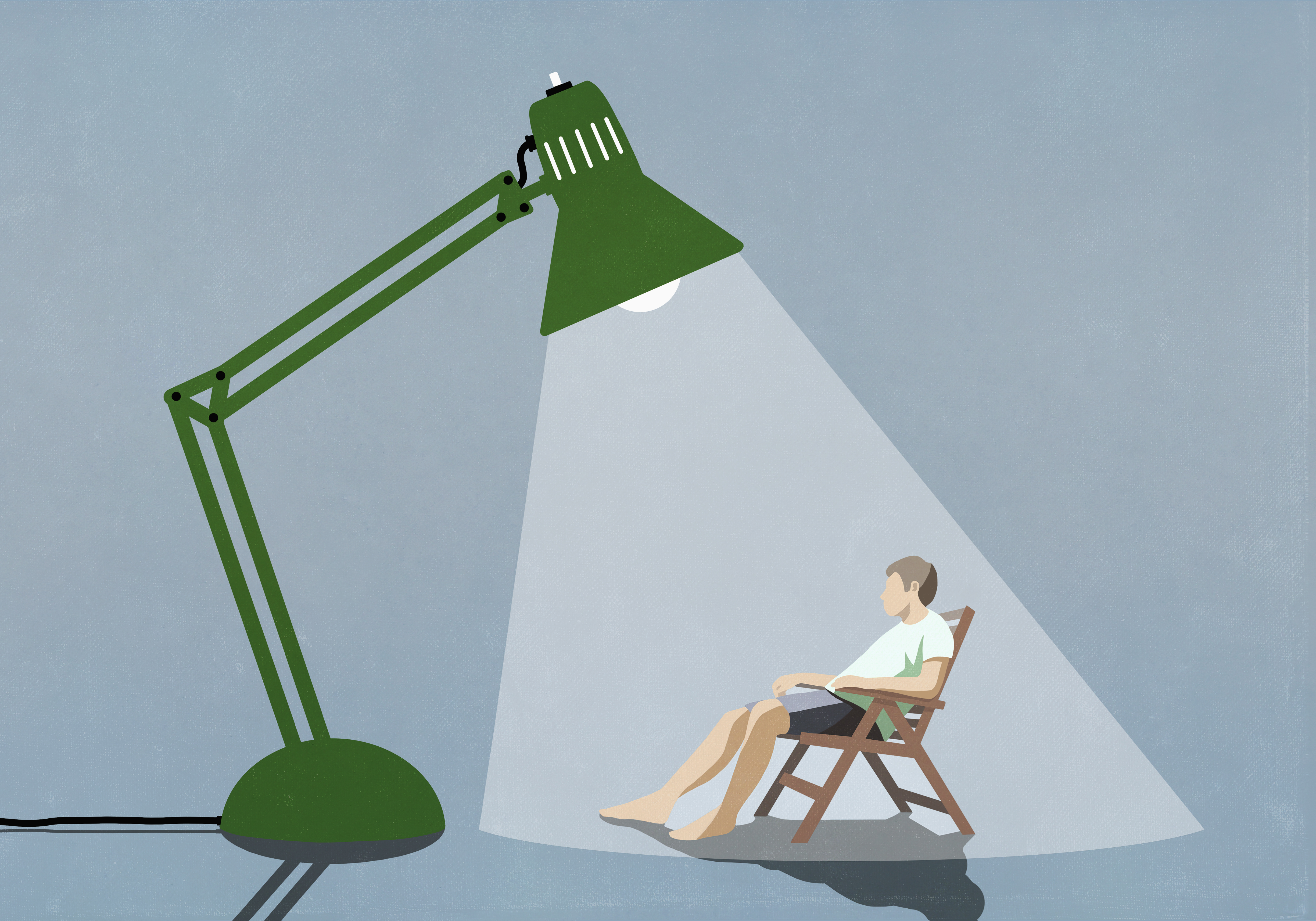 An illustration of a man sitting in a beach chair basking in the light under a giant green articulated desk lamp.
