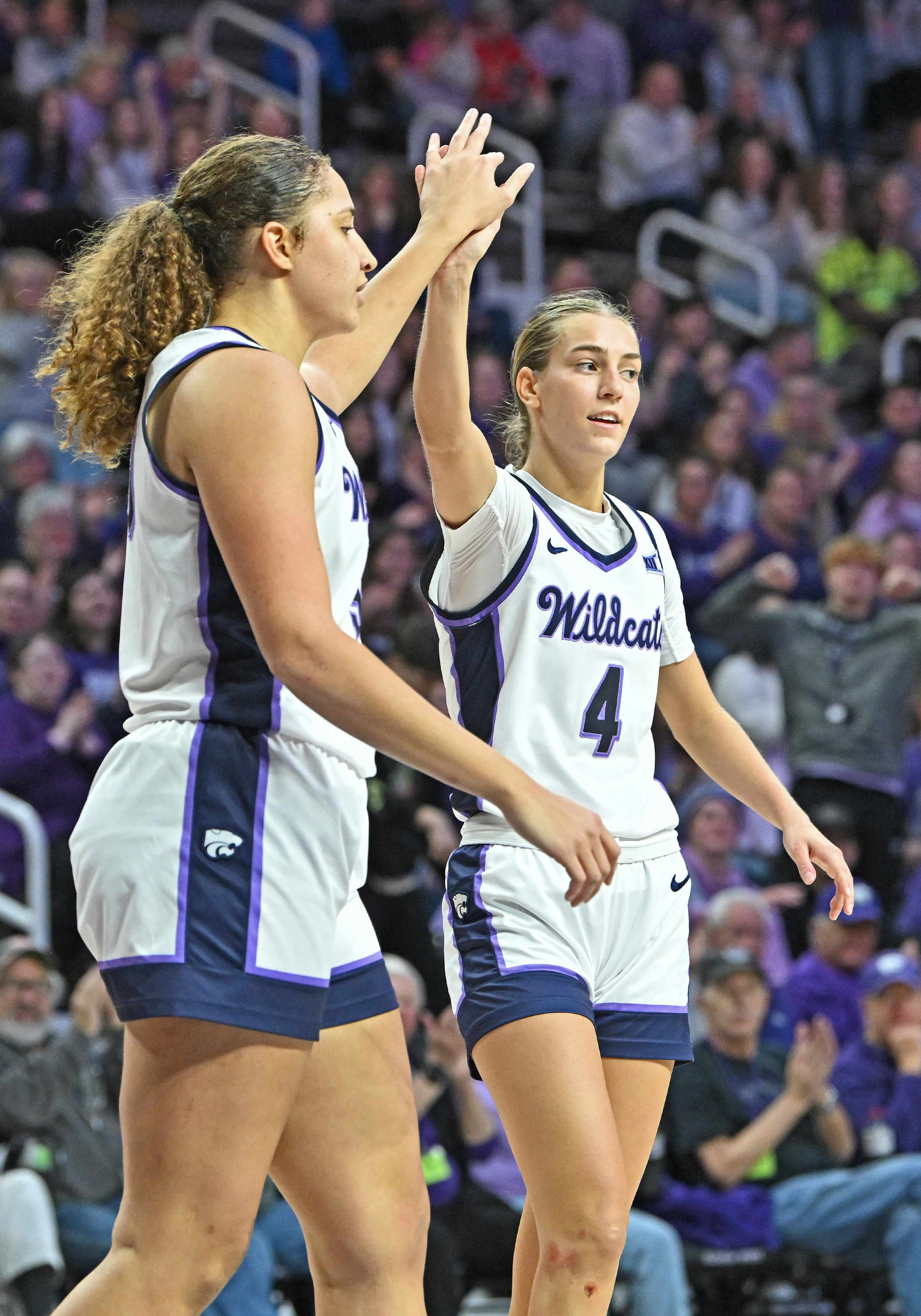 Serena Sundell #4 and Ayoka Lee #50 of the Kansas State Wildcats celebrate after a basket in the second half against the Oklahoma Sooners at Bramlage Coliseum on January 10, 2024 in Manhattan, Kansas.