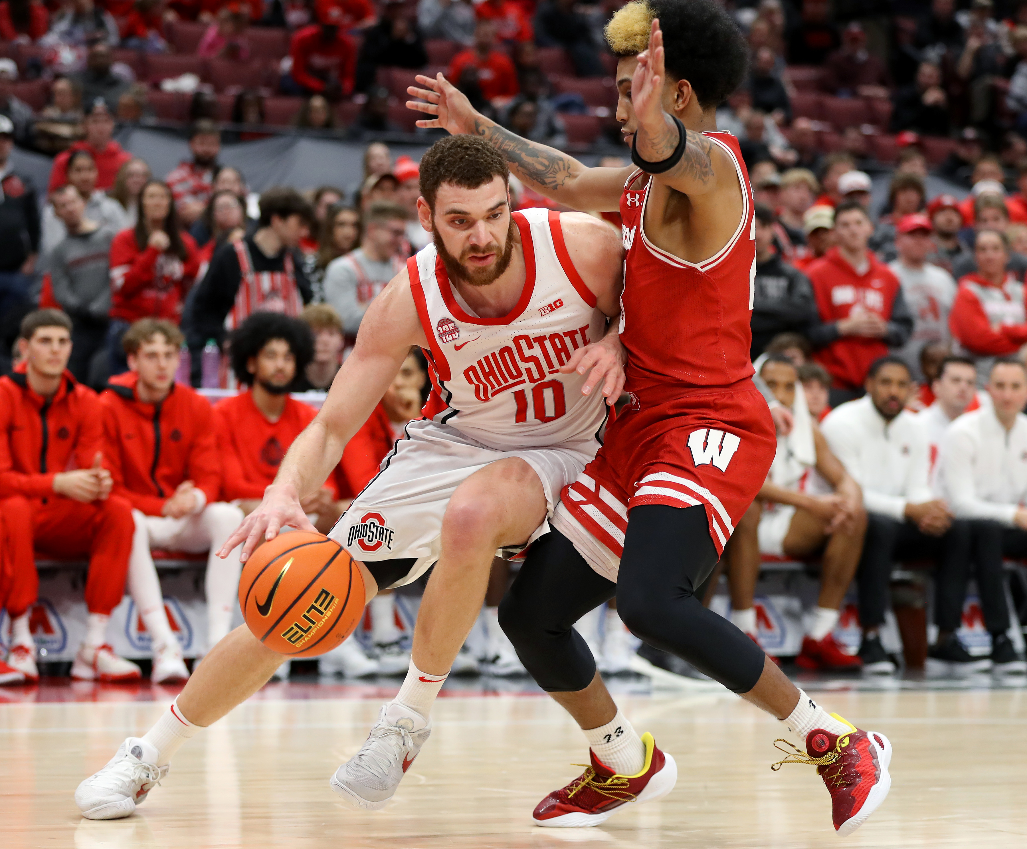 Ohio State Buckeyes forward Jamison Battle dribbles the ball as Wisconsin Badgers guard Chucky Hepburn defends during the second half at Value City Arena.