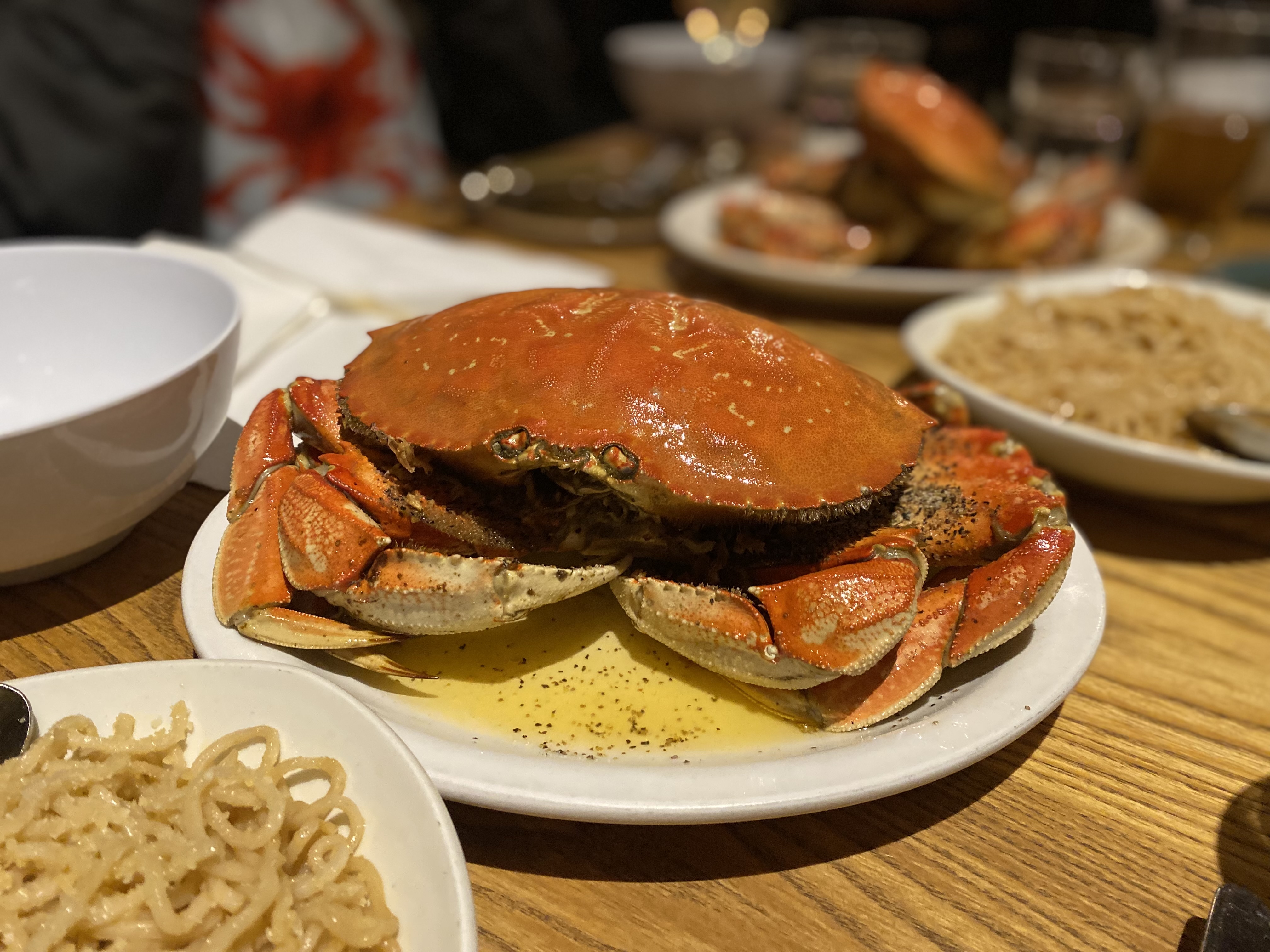 A steamed whole crab on a plate.