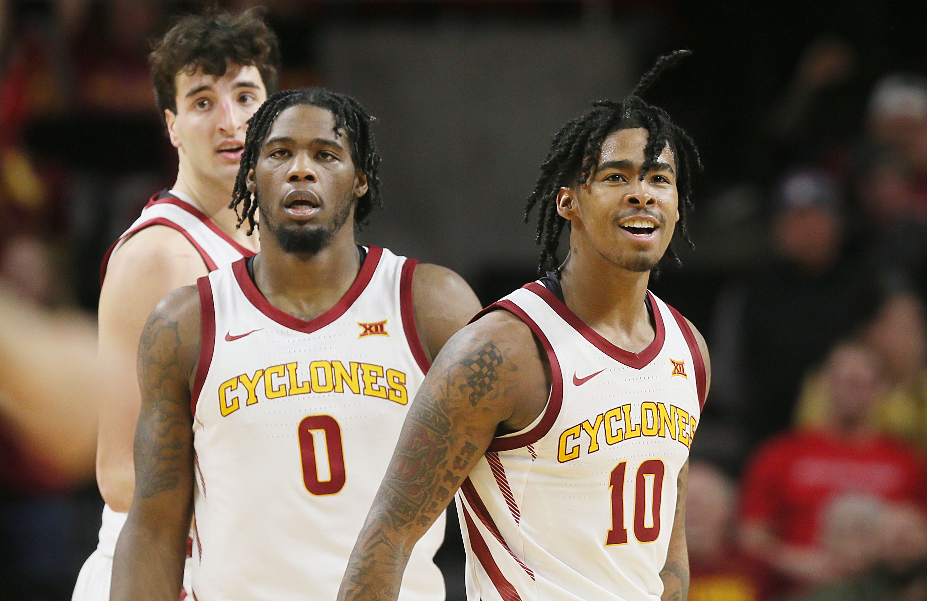 Iowa State Cyclones guard Keshon Gilbert, forward Tre King, and forward Milan Momcilovic celebrate after a score against Houston during the second half in the Big-12 conference showdown of an NCAA college basketball at Hilton Coliseum on Tuesday, Jan. 9, 2024, in Ames, Iowa.