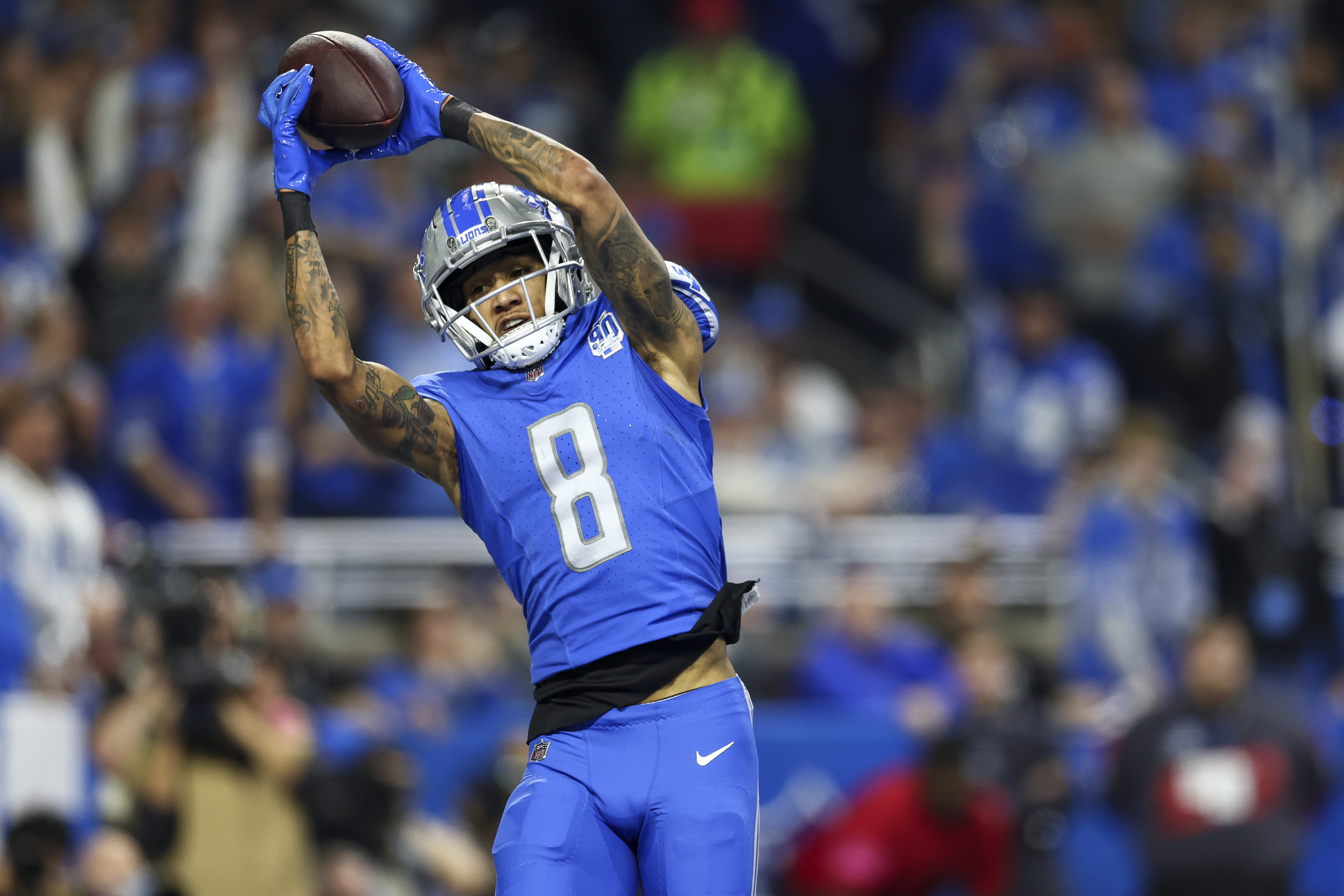 Josh Reynolds #8 of the Detroit Lions catches a pass for a touchdown during the second quarter of an NFL divisional round playoff football game against the Tampa Bay Buccaneers at Ford Field on January 21, 2024 in Detroit, Michigan.