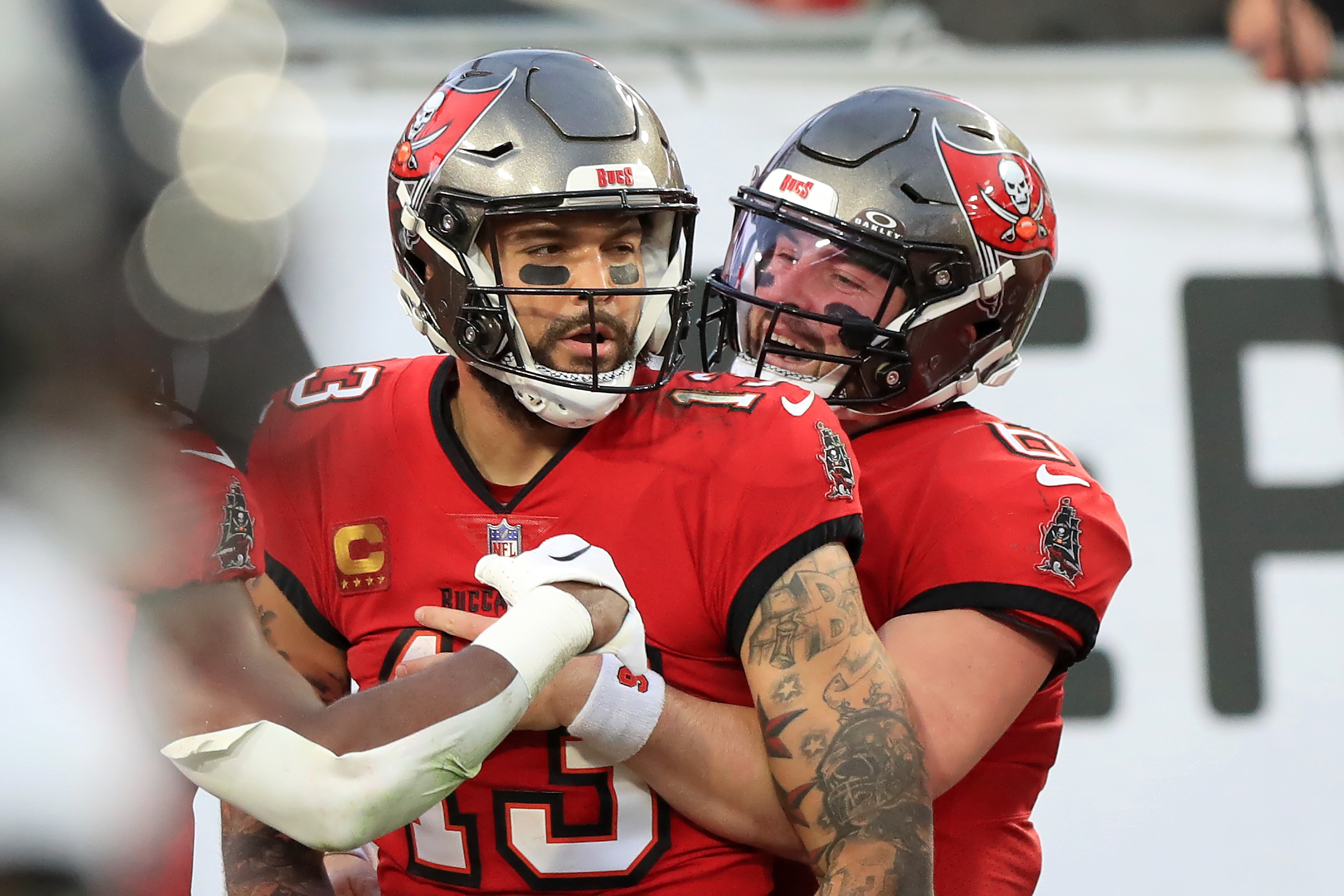 Tampa Bay Buccaneers Wide Receiver Mike Evans scores a touchdown and Quarterback Baker Mayfield hugs Evans during the regular season game between the Jacksonville Jaguars and the Tampa Bay Buccaneers on December 24, 2023 at Raymond James Stadium in Tampa, Florida.