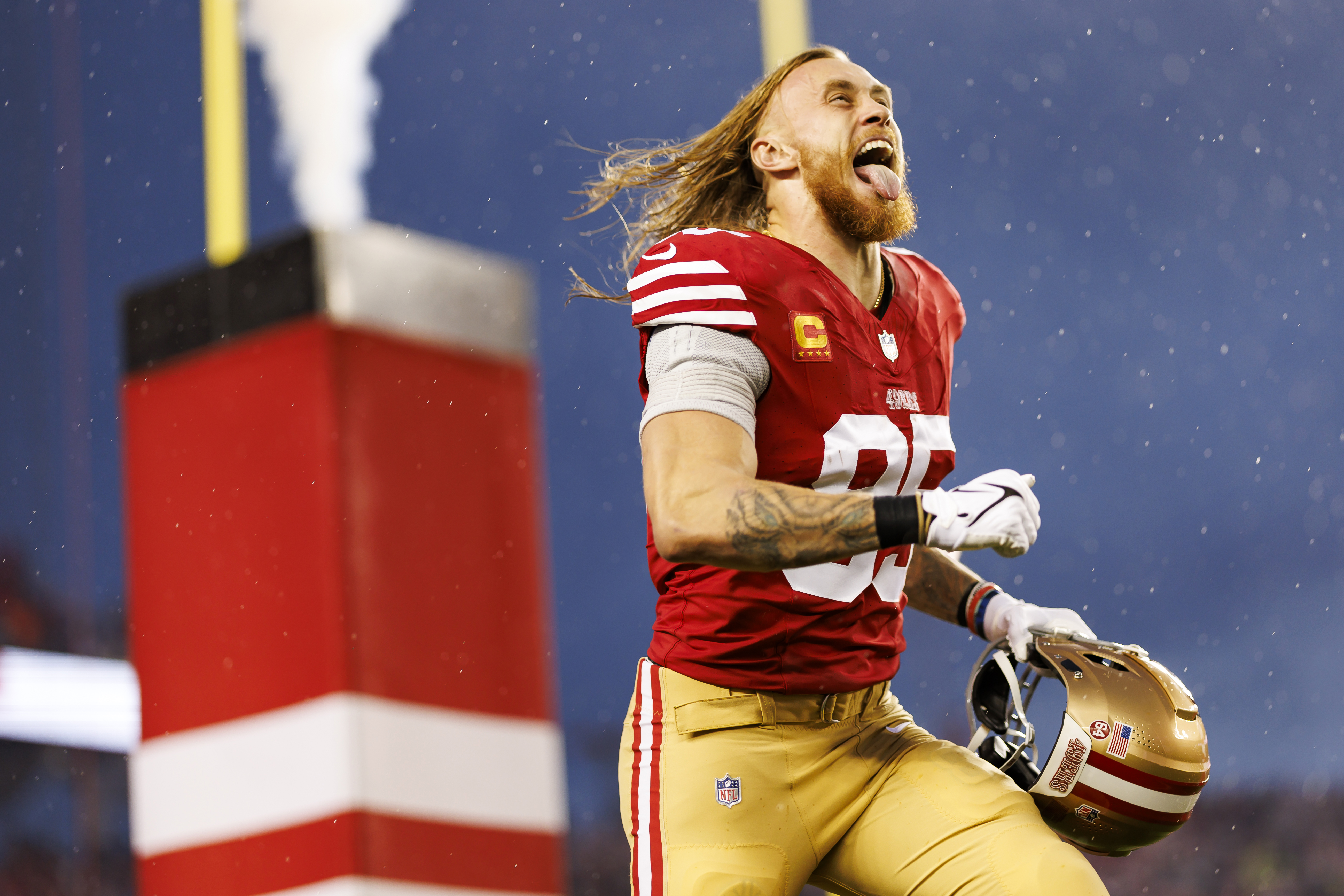 George Kittle #85 of the San Francisco 49ers celebrates as he runs onto the field during player introductions before an NFC divisional round playoff football game against the Green Bay Packers at Levi’s Stadium on January 20, 2024 in Santa Clara, California.