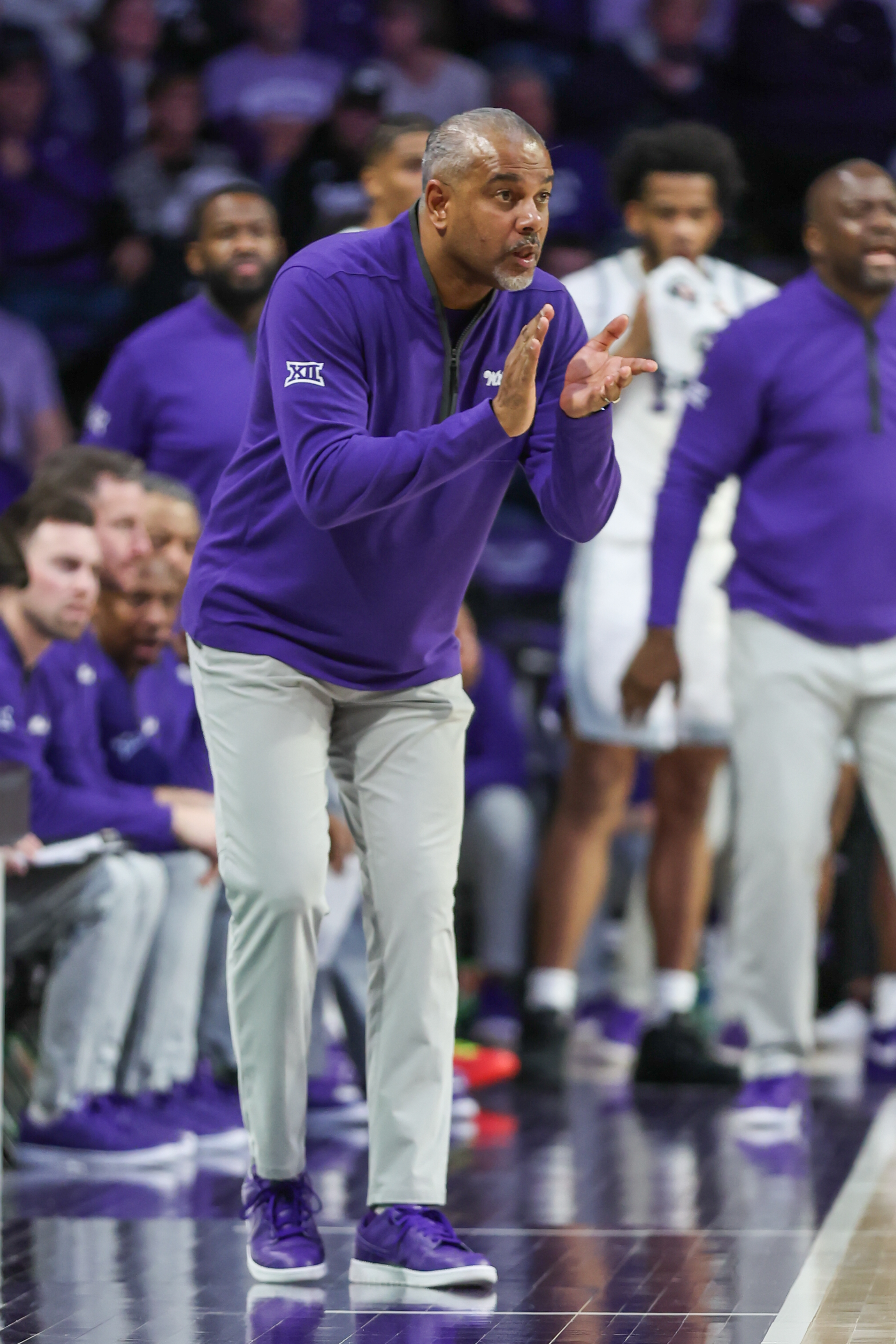 Kansas State Wildcats head coach Jerome Tang claps and cheers on his team in the second half of a Big 12 basketball game between the Oklahoma Sooners and Kansas State Wildcats on Jan 30, 2024 at Bramlage Coliseum in Manhattan, KS.