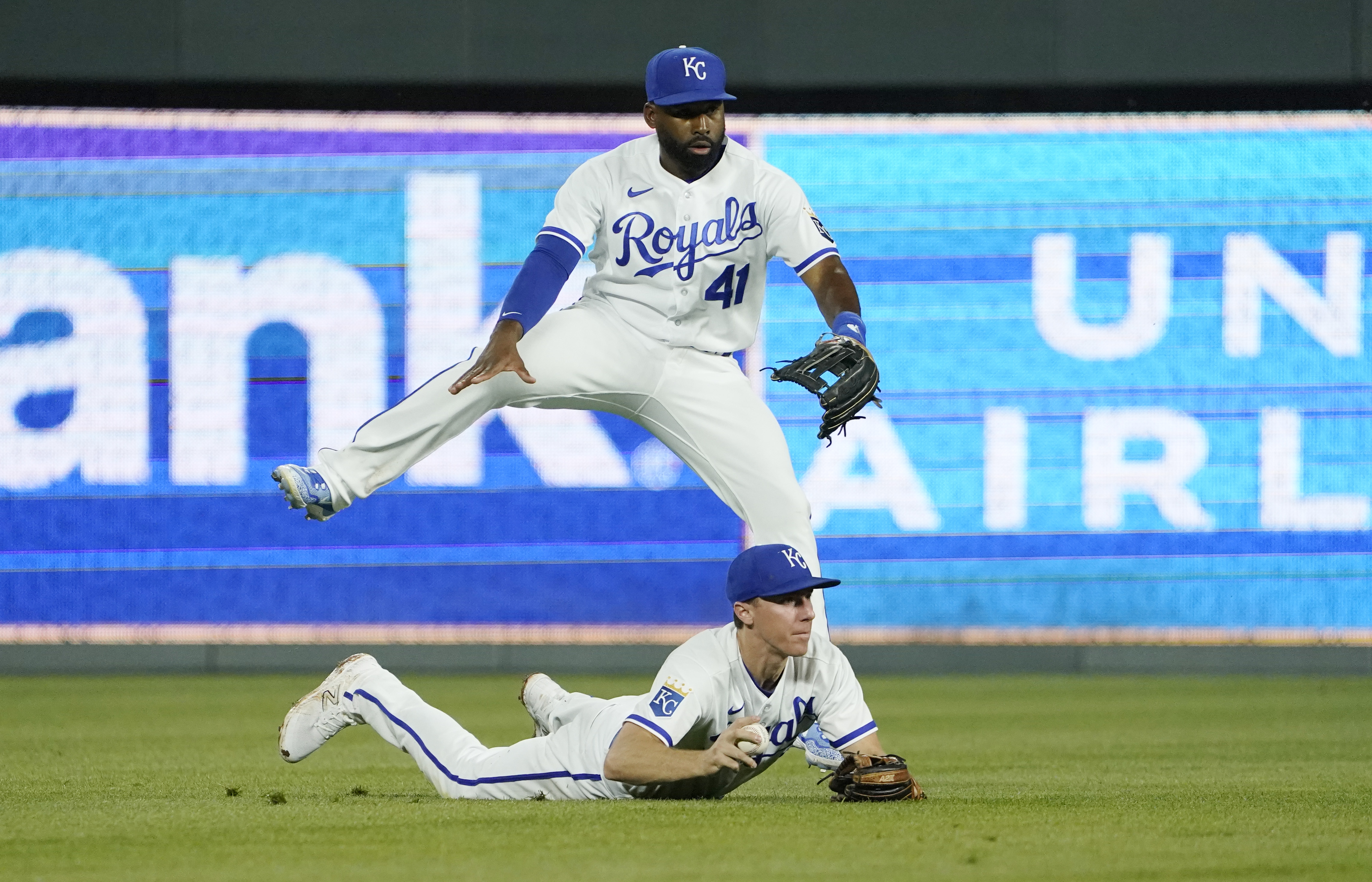 Matt Duffy #15 of the Kansas City Royals, backed up by Jackie Bradley Jr. #41, fields a ball off the bat of Spencer Torkelson of the Detroit Tigers avoids a collision in the eighth inning at Kauffman Stadium on May 24, 2023 in Kansas City, Missouri.