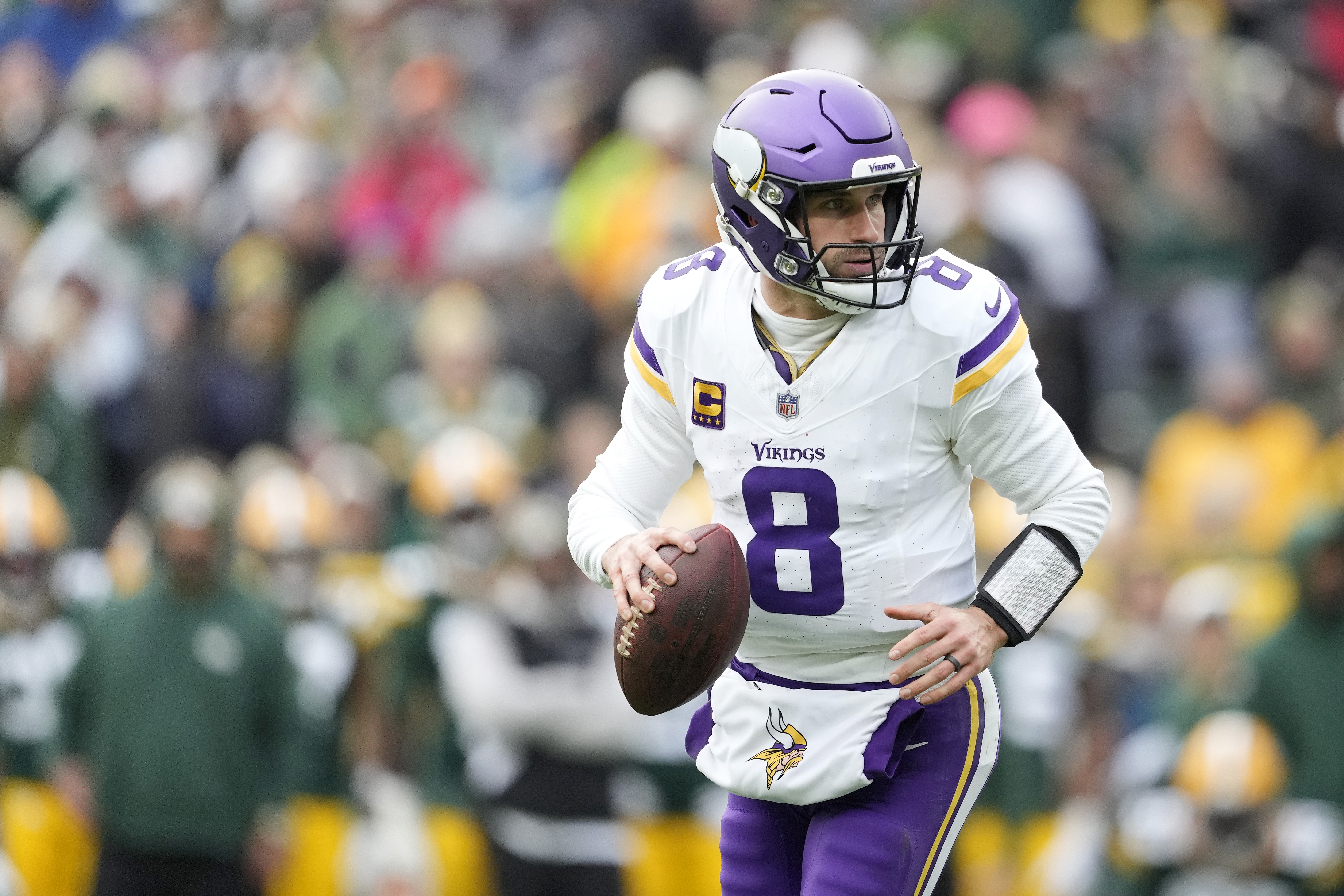 Kirk Cousins #8 of the Minnesota Vikings looks to throw a pass against the Green Bay Packers in the second half at Lambeau Field on October 29, 2023 in Green Bay, Wisconsin.
