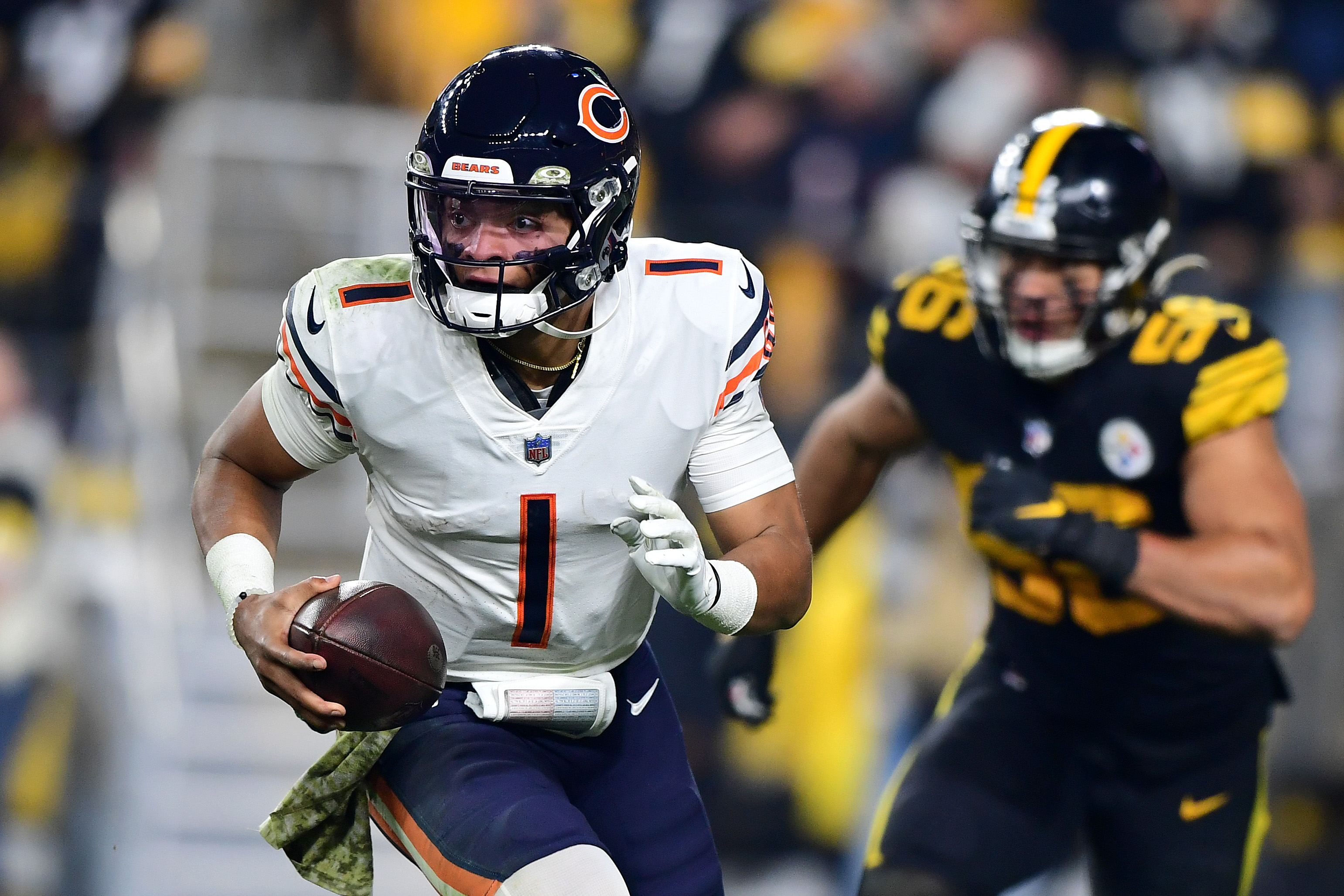Quarterback Justin Fields #1 of the Chicago Bears throws the ball down the field against the Pittsburgh Steelers during the third quarter at Heinz Field on November 8, 2021 in Pittsburgh, Pennsylvania.