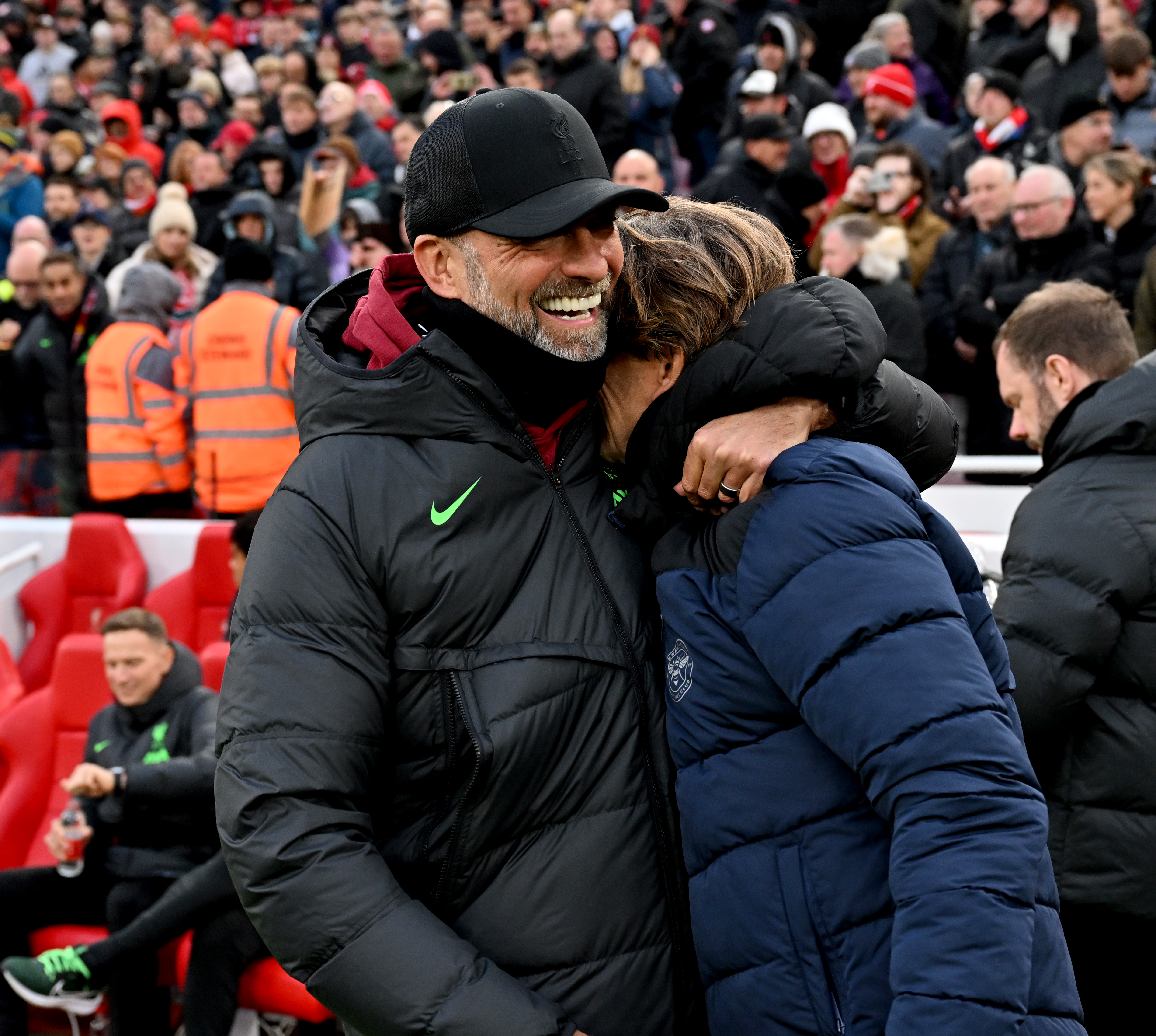 Jürgen Klopp manager of Liverpool hugs Thomas Frank manager of Brentford before the Premier League match between Liverpool FC and Brentford FC at Anfield on November 12, 2023 in Liverpool, England.