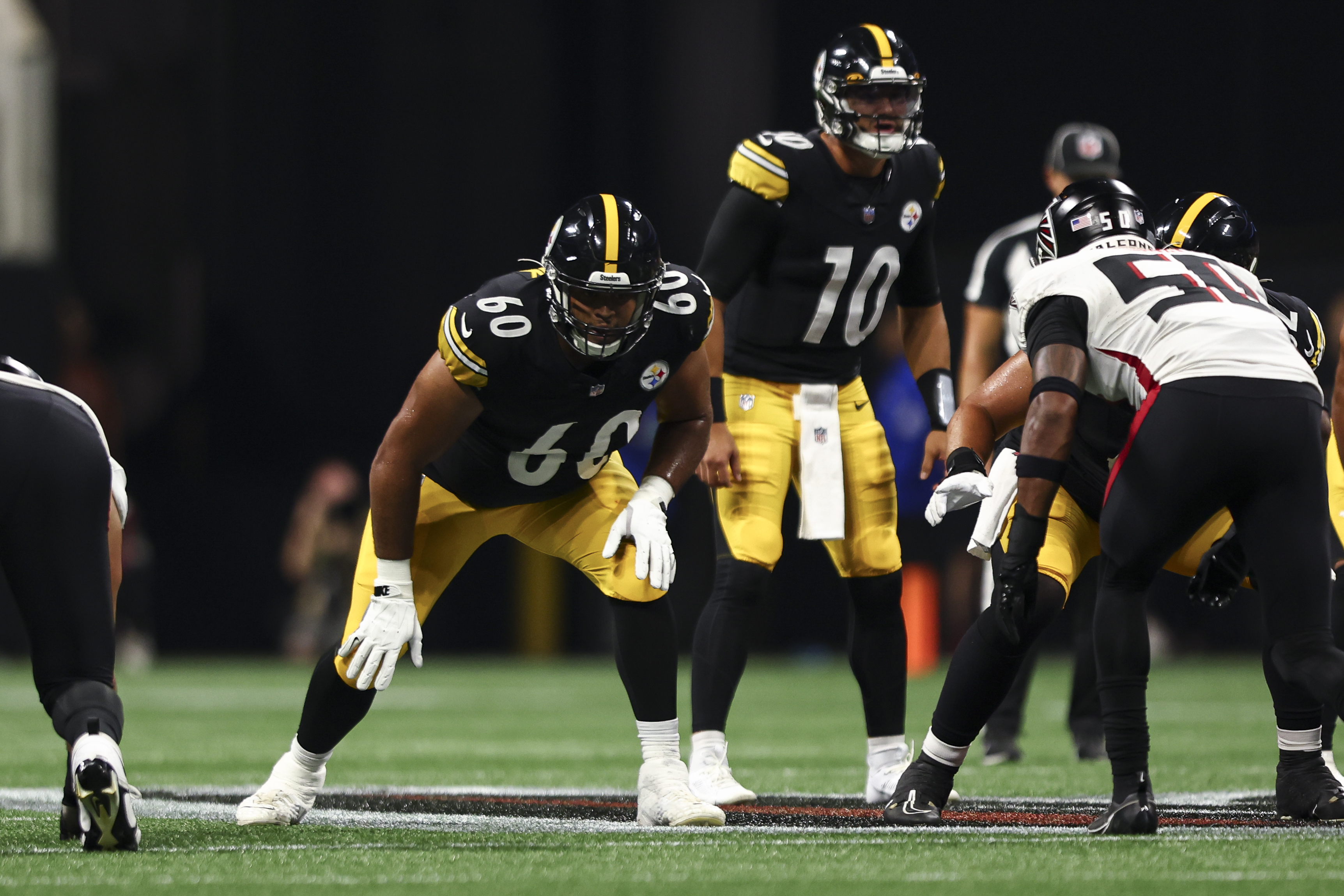 Dylan Cook #60 of the Pittsburgh Steelers lines up before a play during an NFL preseason football game against the Atlanta Falcons at Mercedes-Benz Stadium on August 24, 2023 in Atlanta, Georgia.