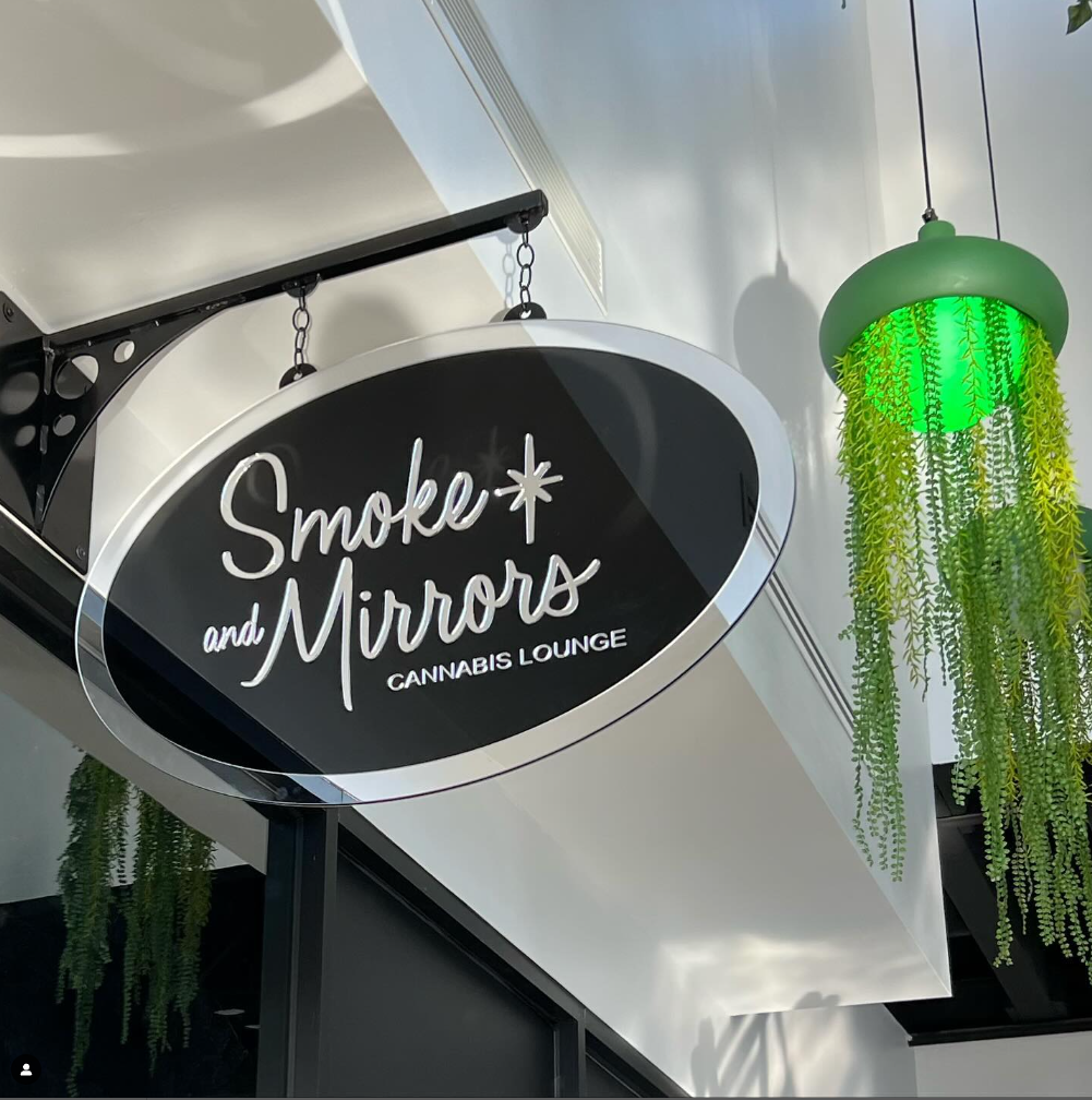 A sign for the Smoke &amp; Mirrors cannabis lounge.