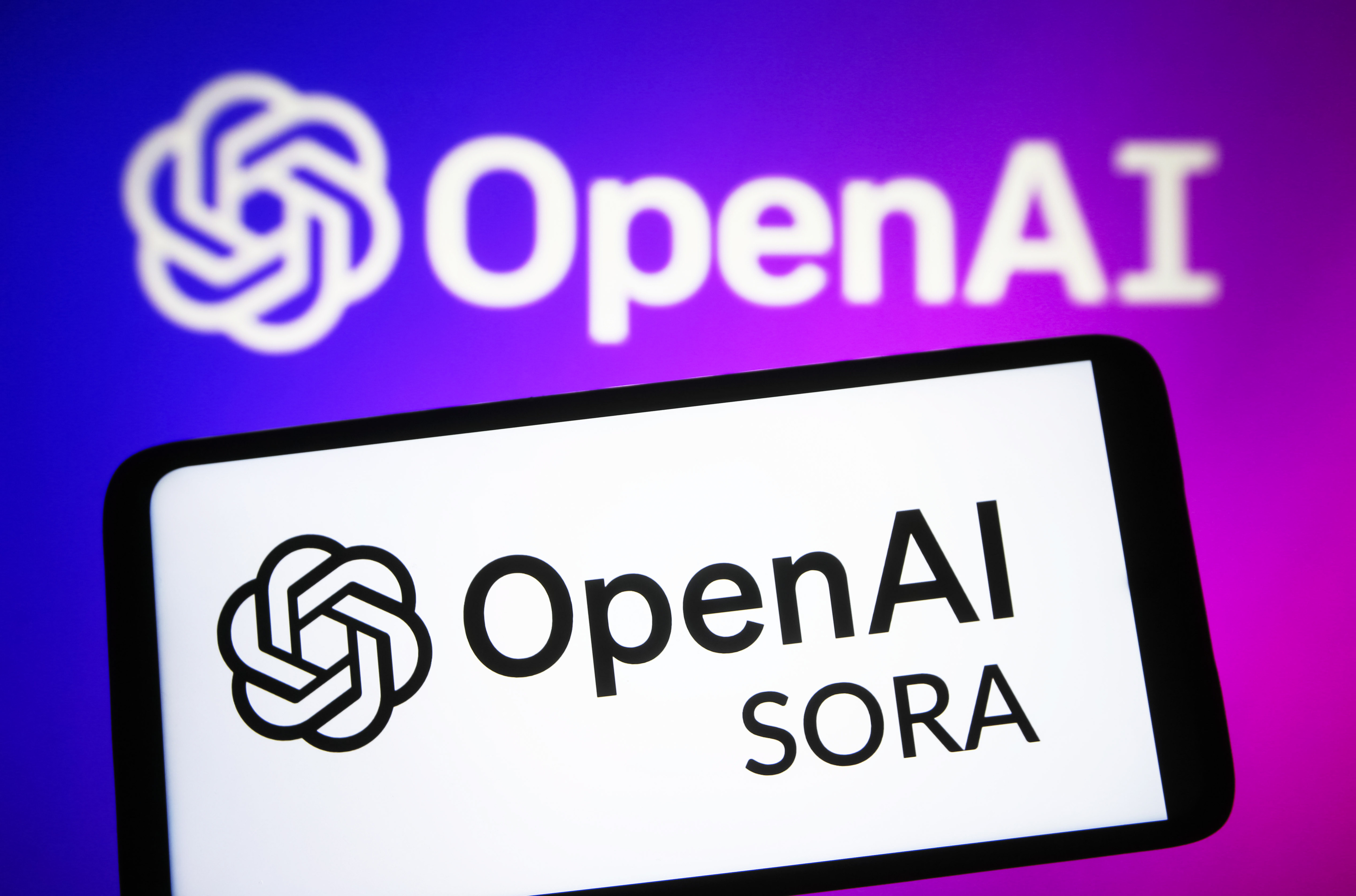 In this photo illustration, Open AI Sora logo is seen on a...